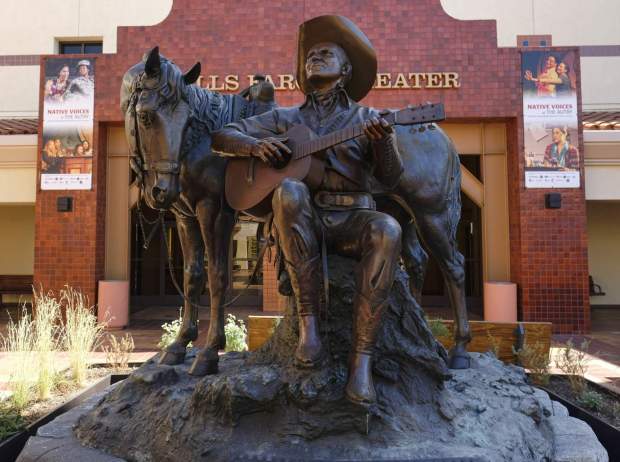 A statue of Gene Autry stands at the entrance to the Autry Museum of the American West in Los Angeles. (2016 AP Photo/Richard Vogel)