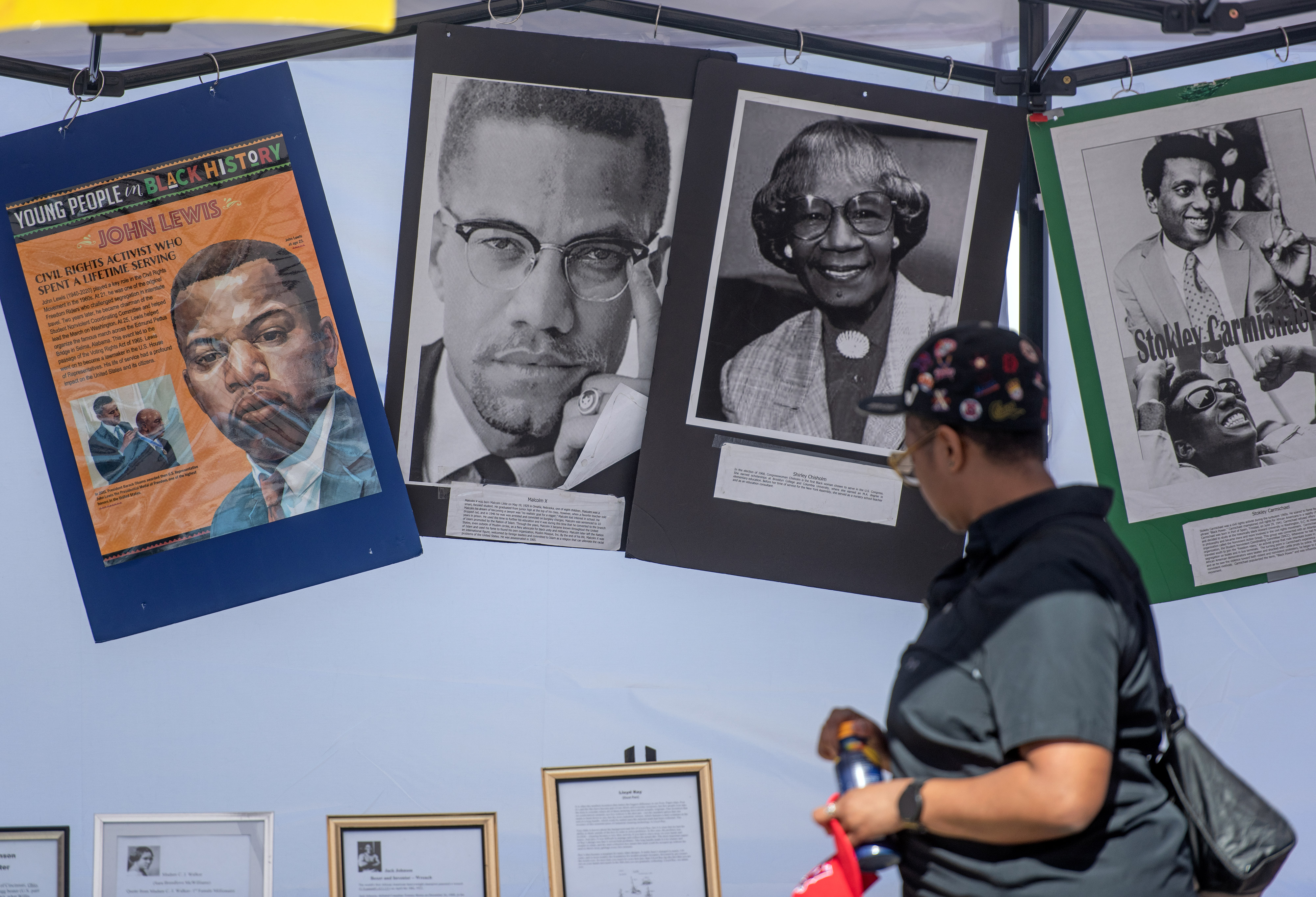 Ebony Demyers of Santa Ana checks out a display featuring...