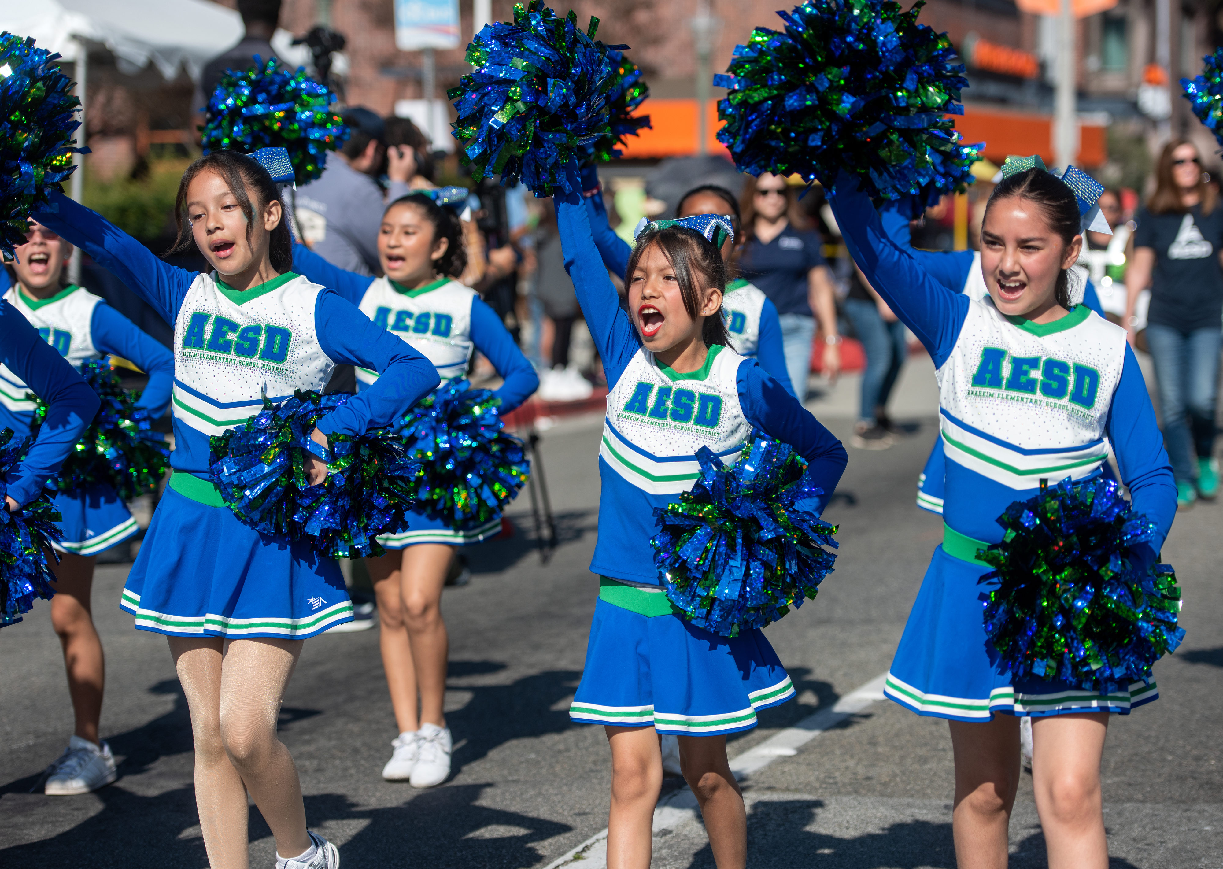 Students from Anaheim Elementary School District march and cheer their...