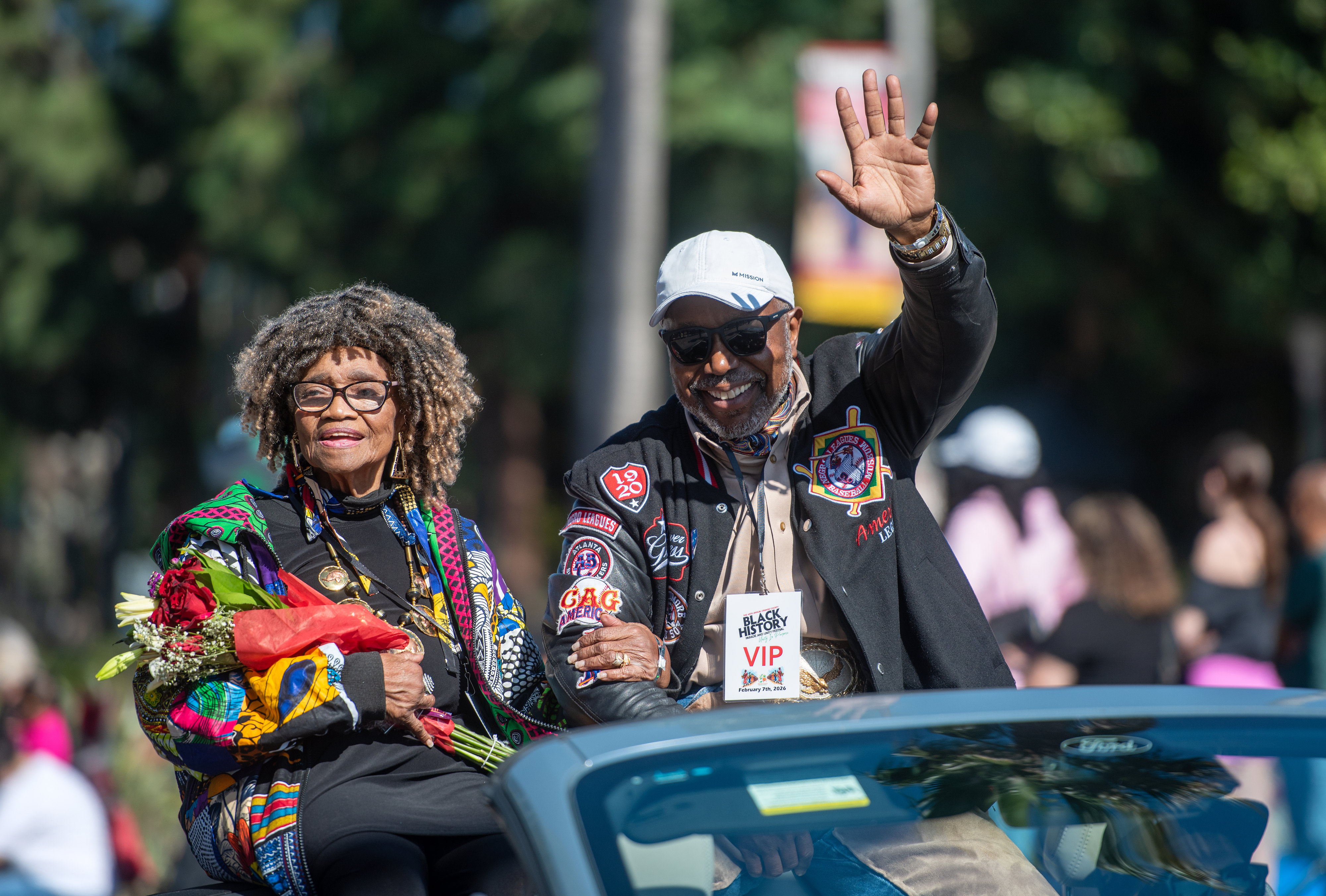 Actor William Pugh waves to the crowd from the back...