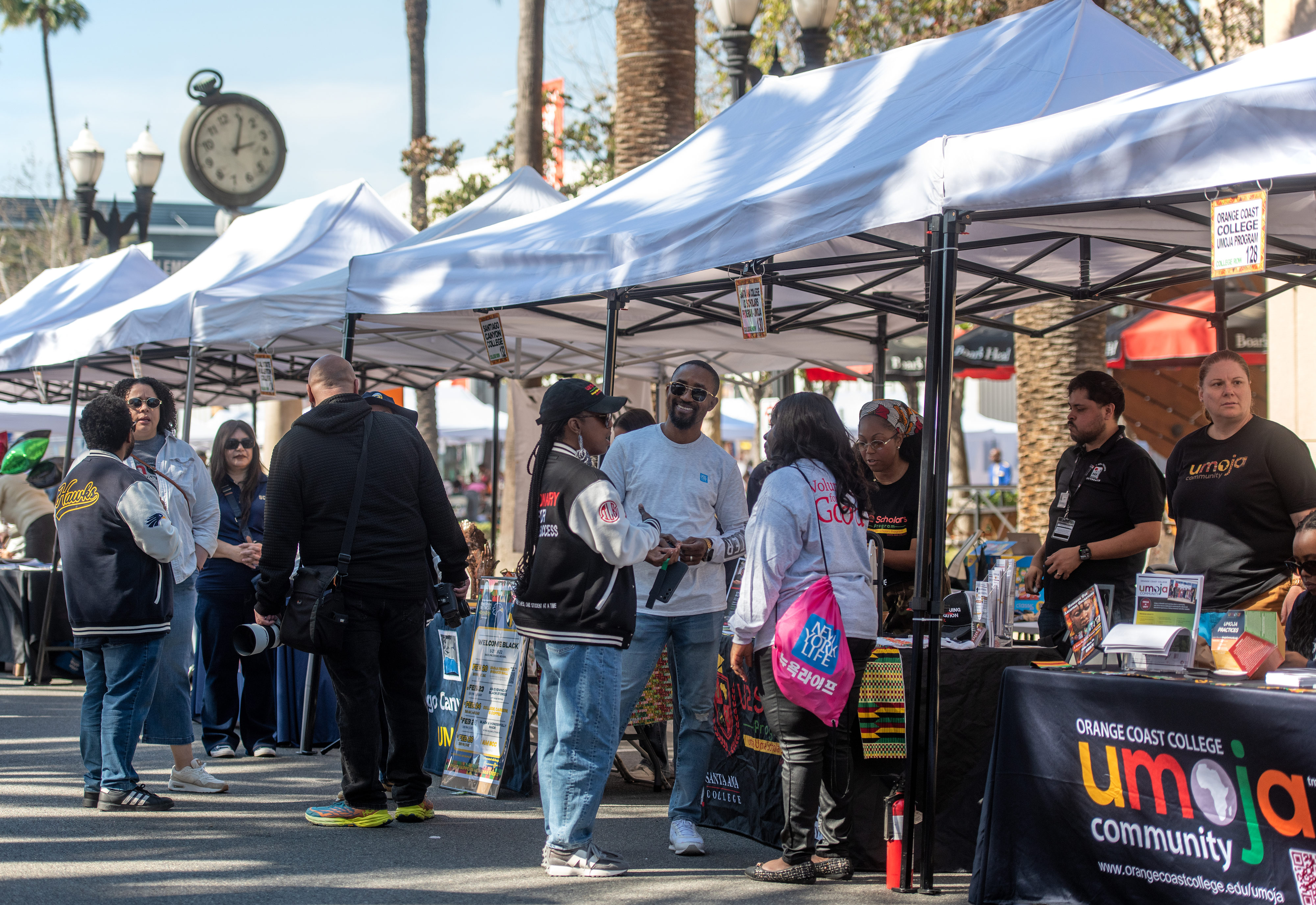 Visitors make their way through vendor and organization booths at...