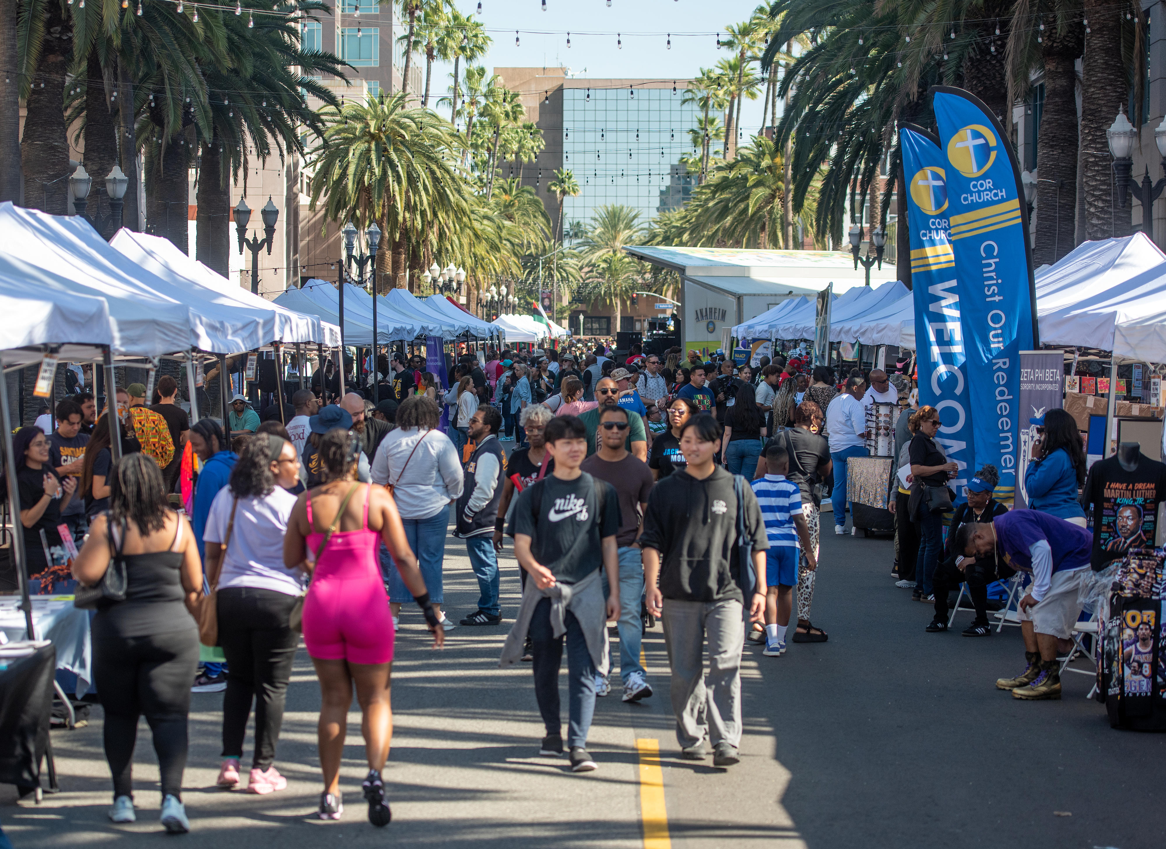 Visitors make their way through vendor and organization booths at...
