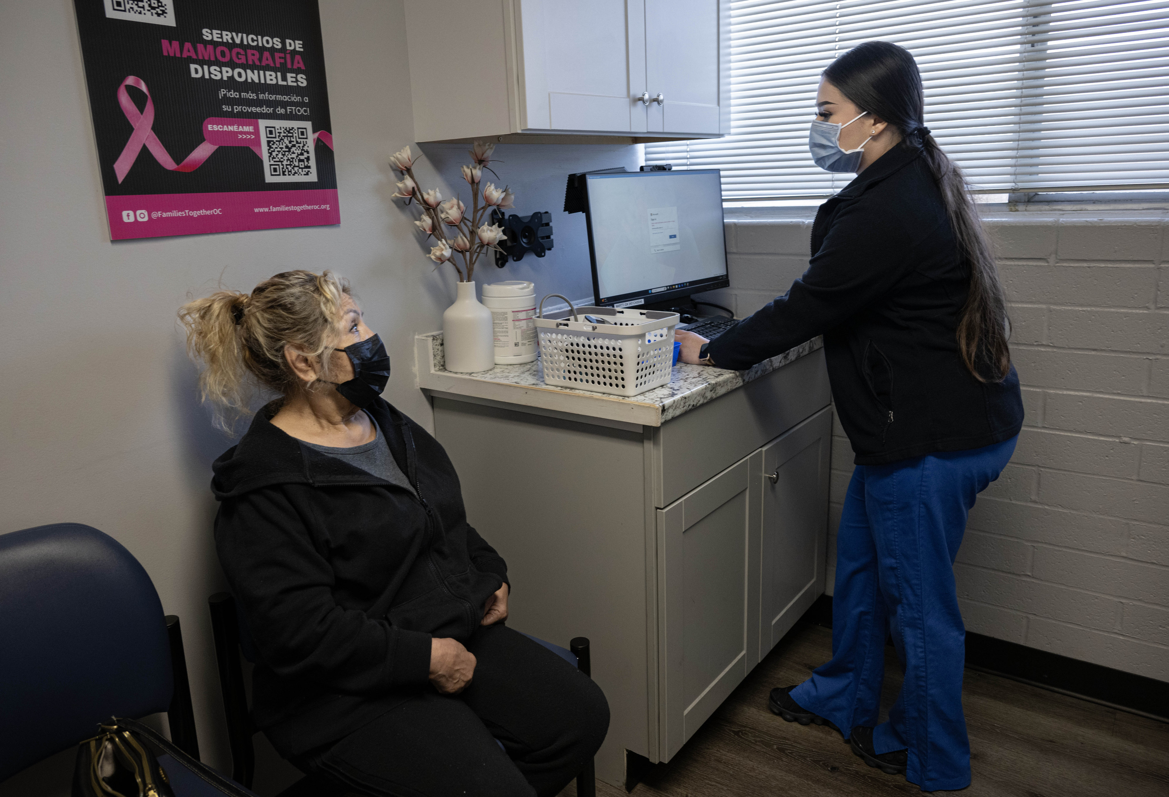Medical assistant Kim Oviedo chats with a patient at Families...