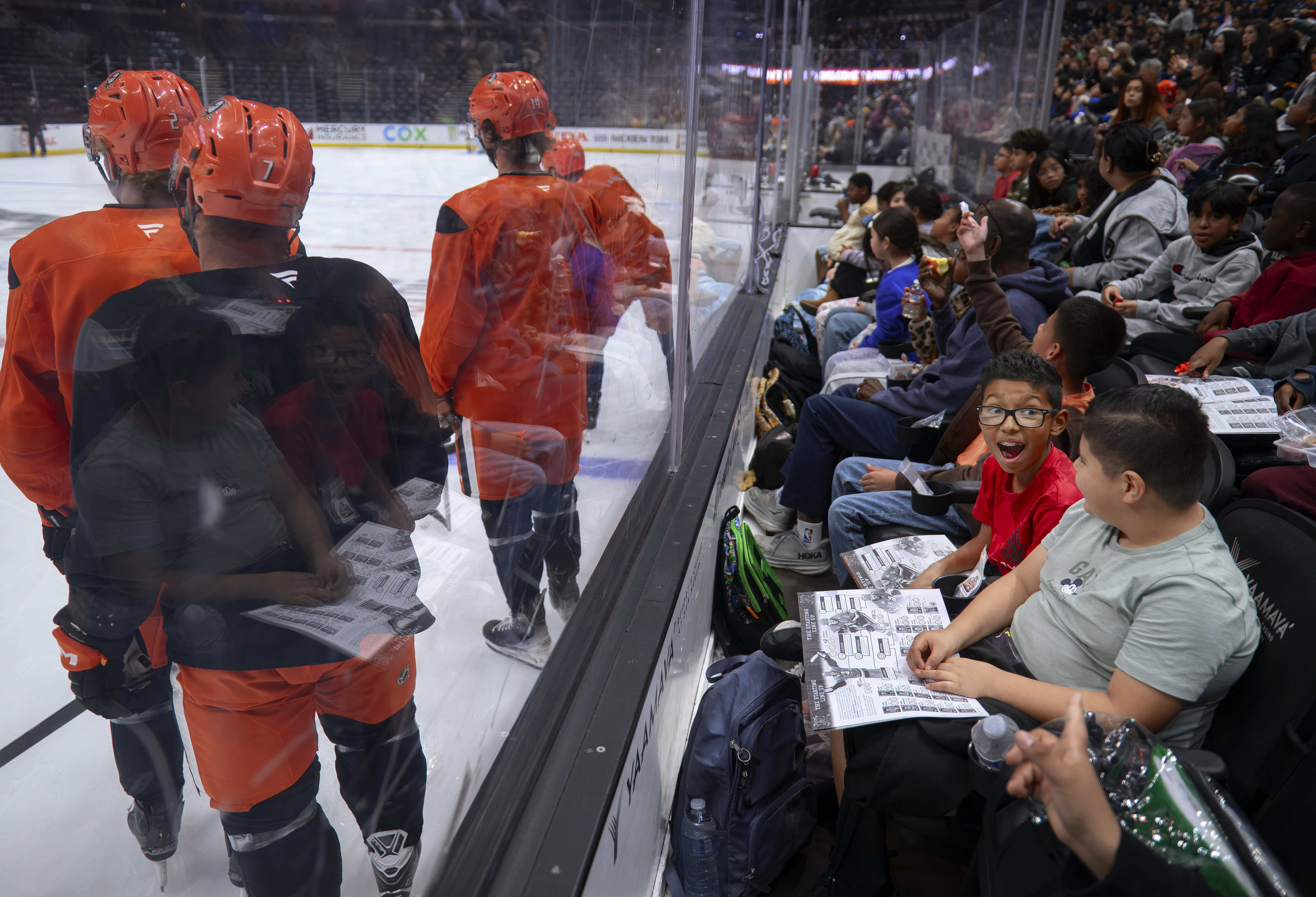 Excited school kids see Anaheim Ducks players up close at...