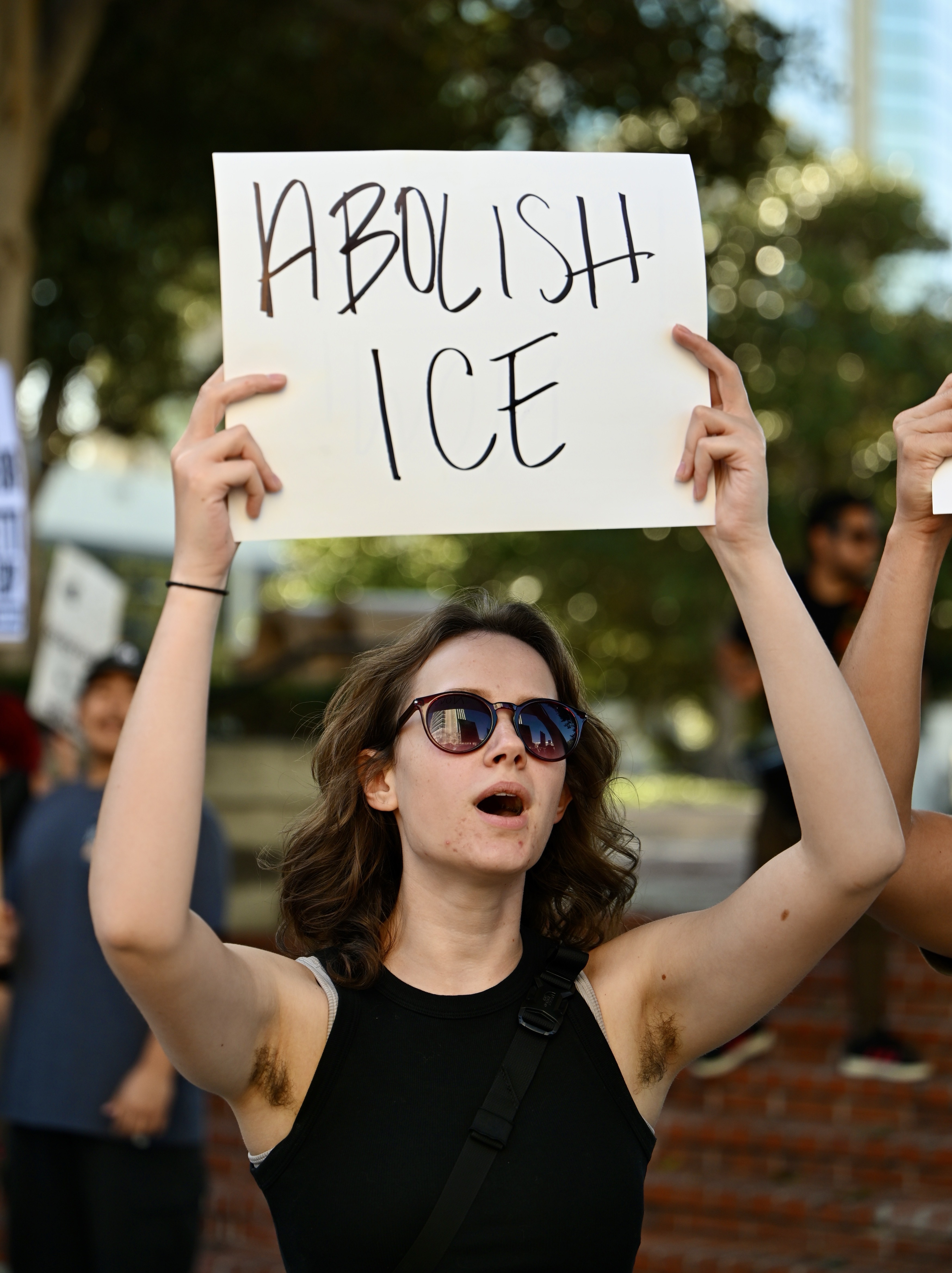 Olivia Cooper, from Garden Grove, chants during a demonstration against...