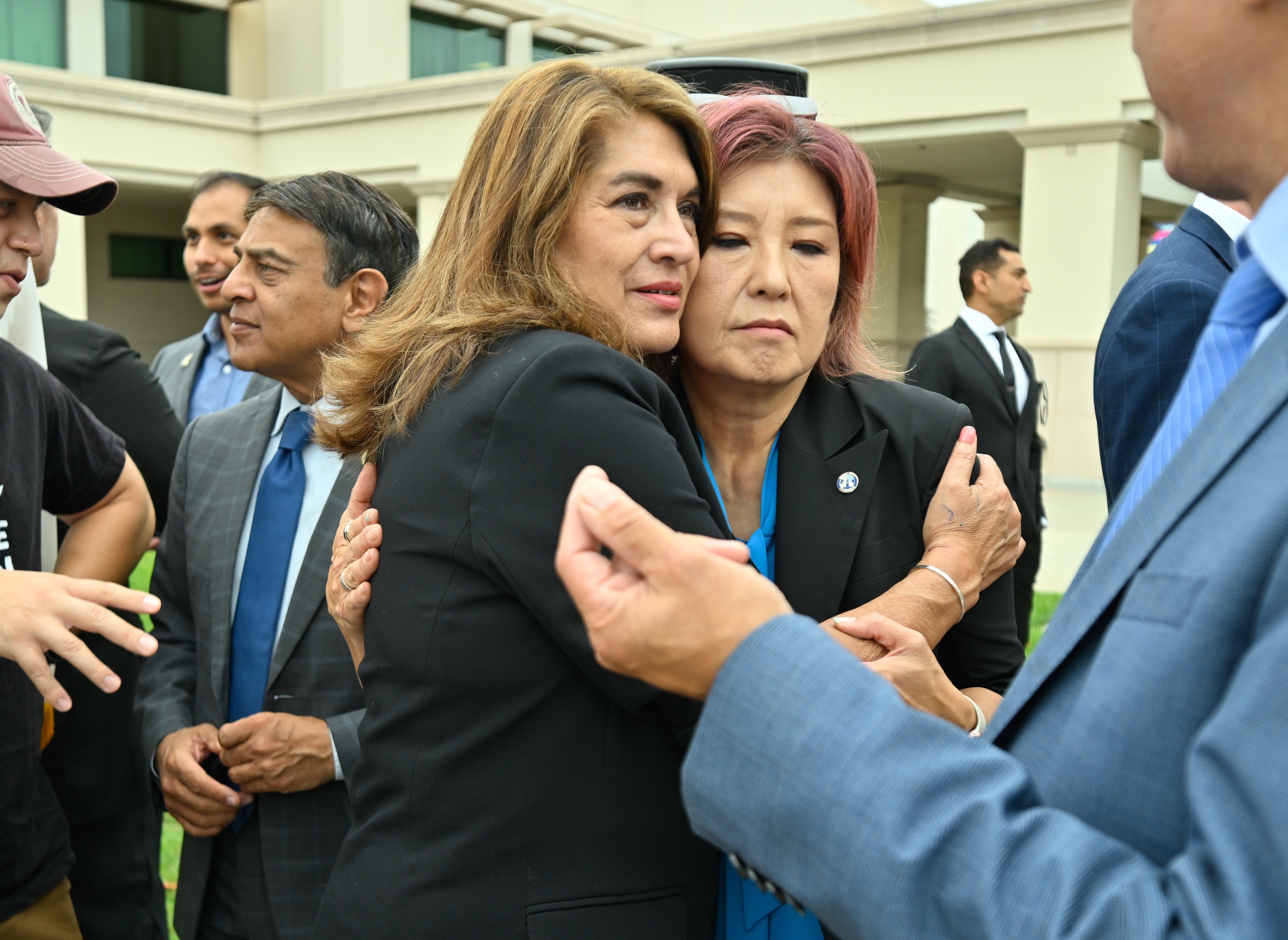 Assemblywoman Sharon Quirk-Silva, left, hugs Buena Park Mayor Joyce Ahn...