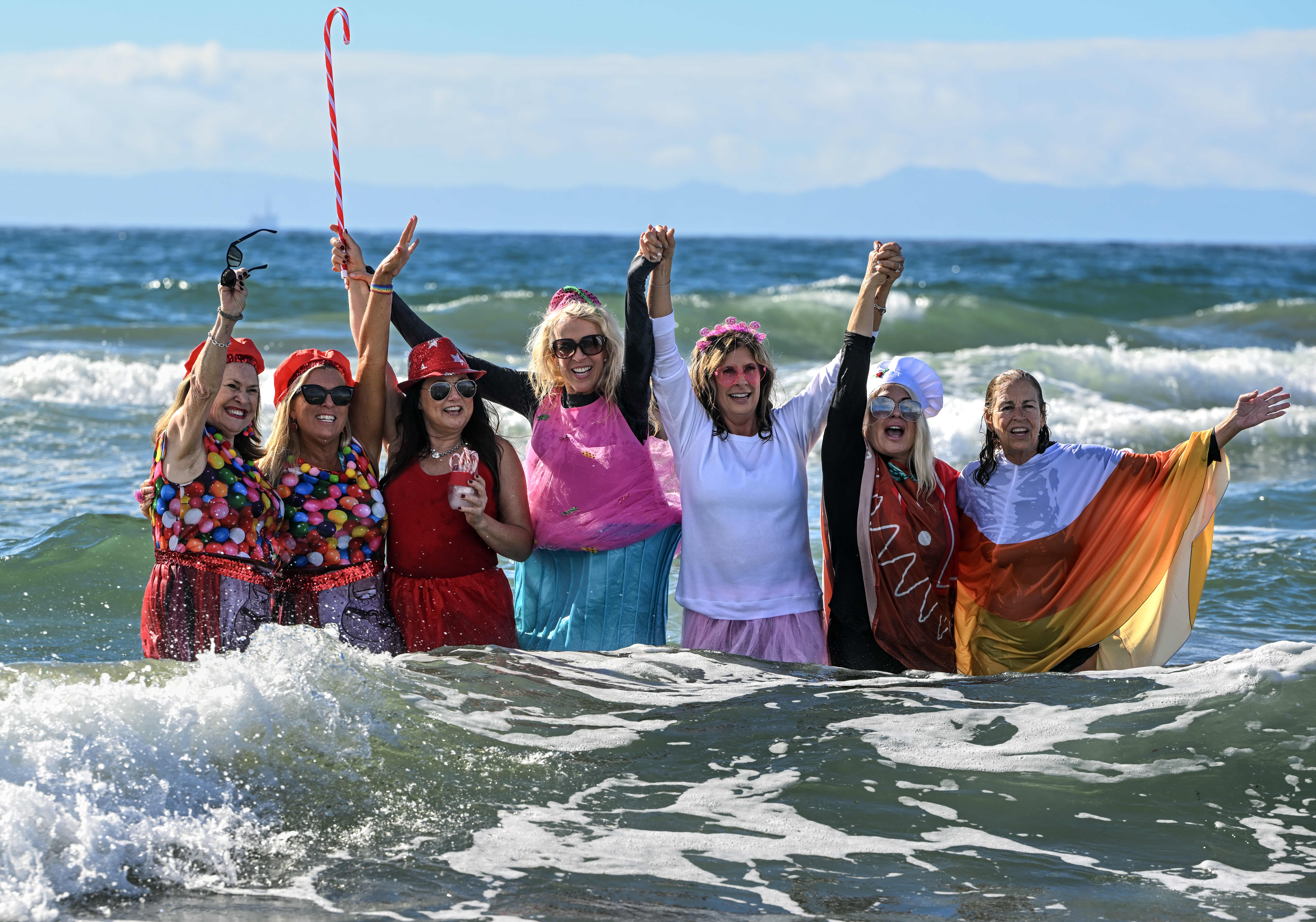 A group of friends dress as desserts during the Surf...