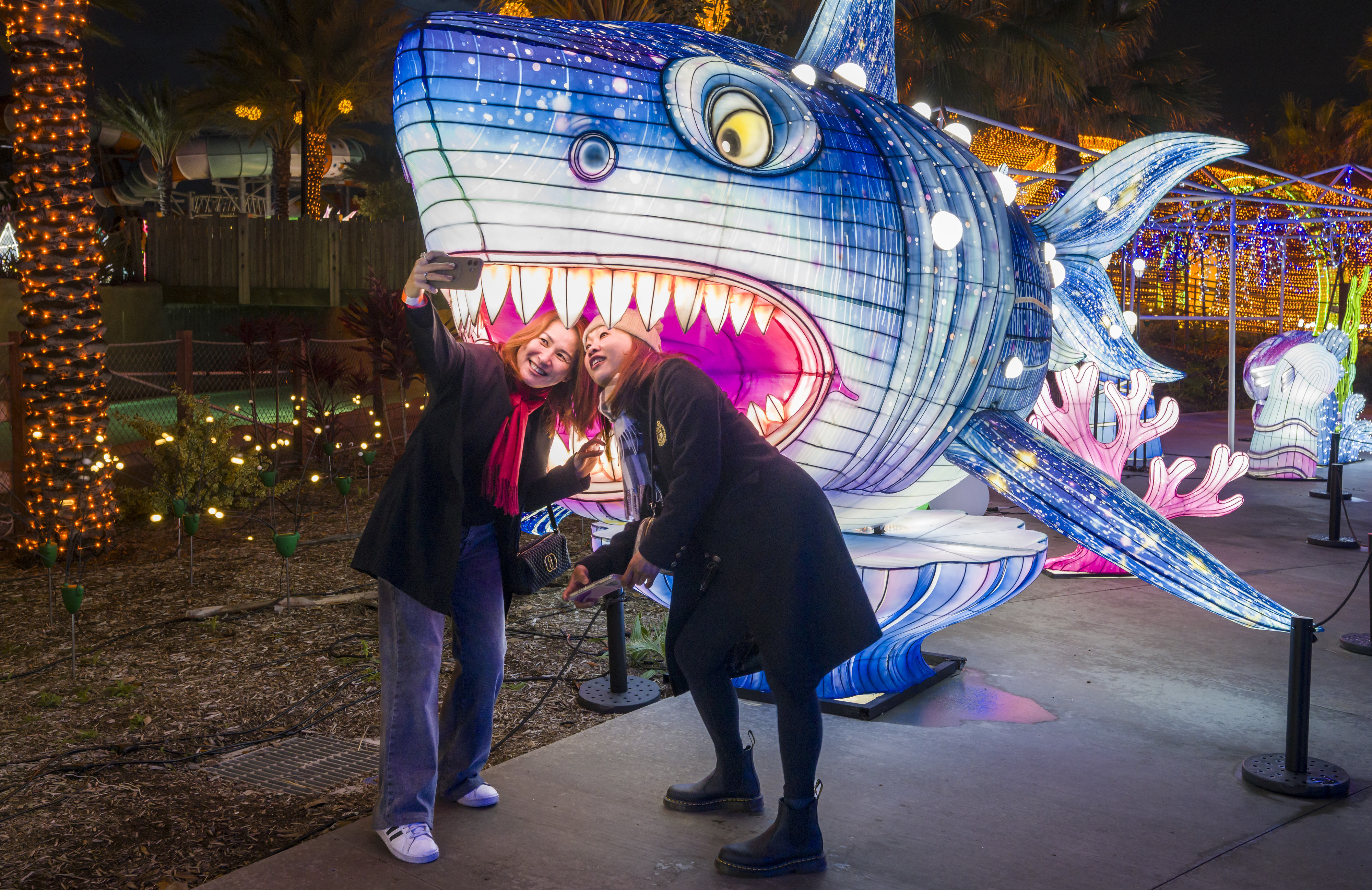 Kristy Chen, left, and Eunice Chow take a selfie in...