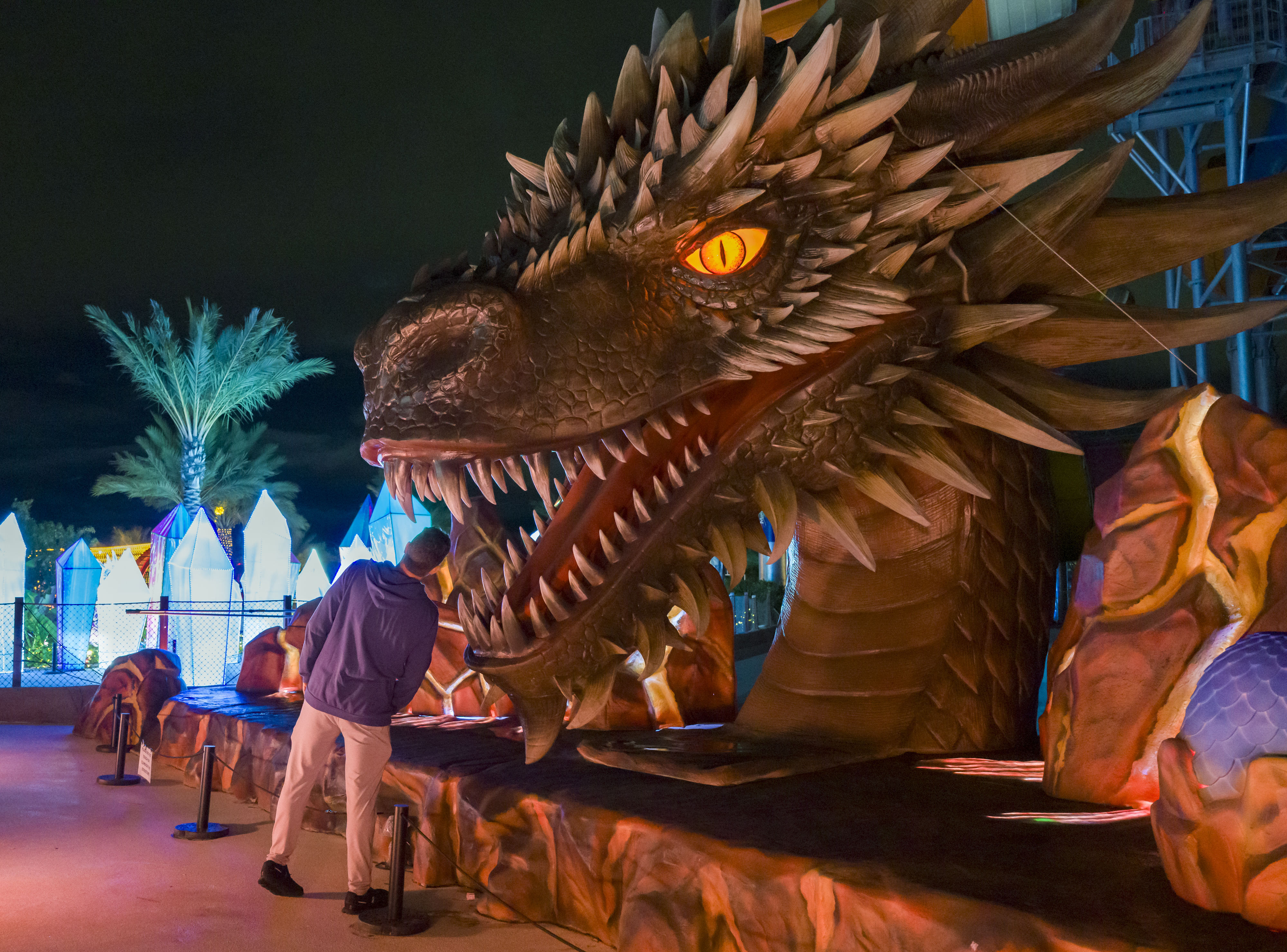 A man looks into the mouth of a giant dragon...