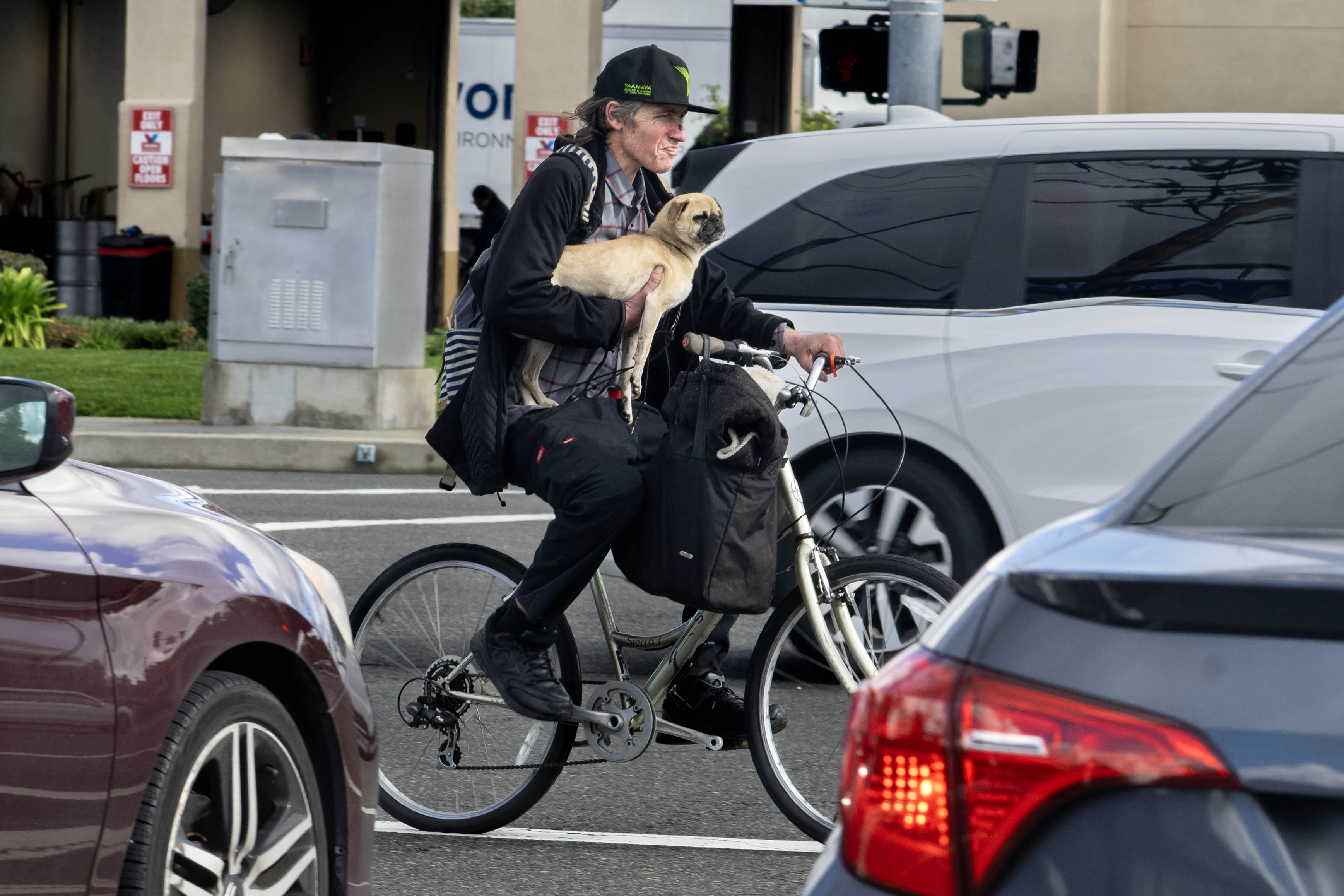Matt Bryant hustles through Garden Grove traffic with an unkempt...