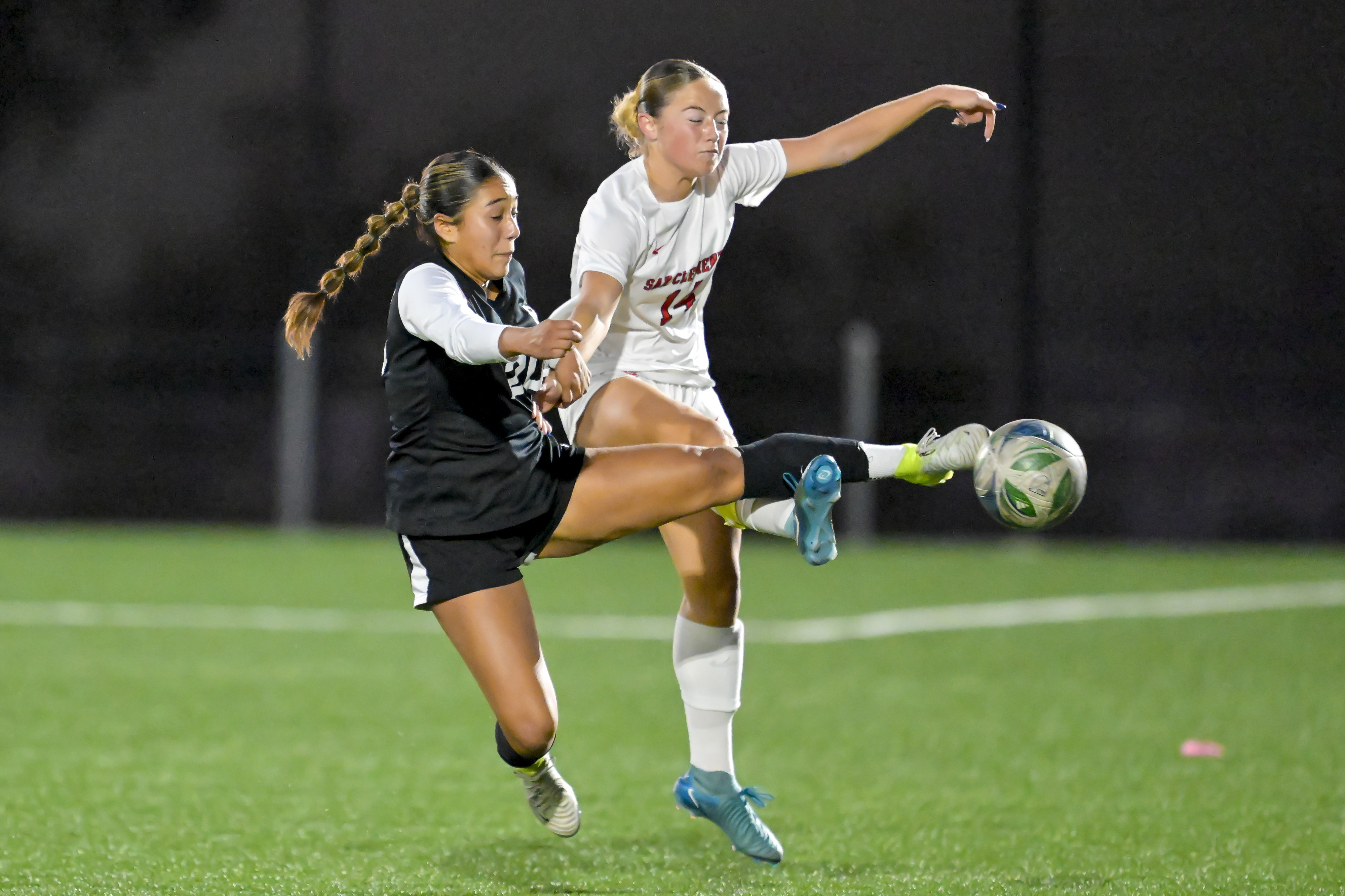 Savannah Aquino (20) of Capistrano Valley and Jayden Smythers (14)...