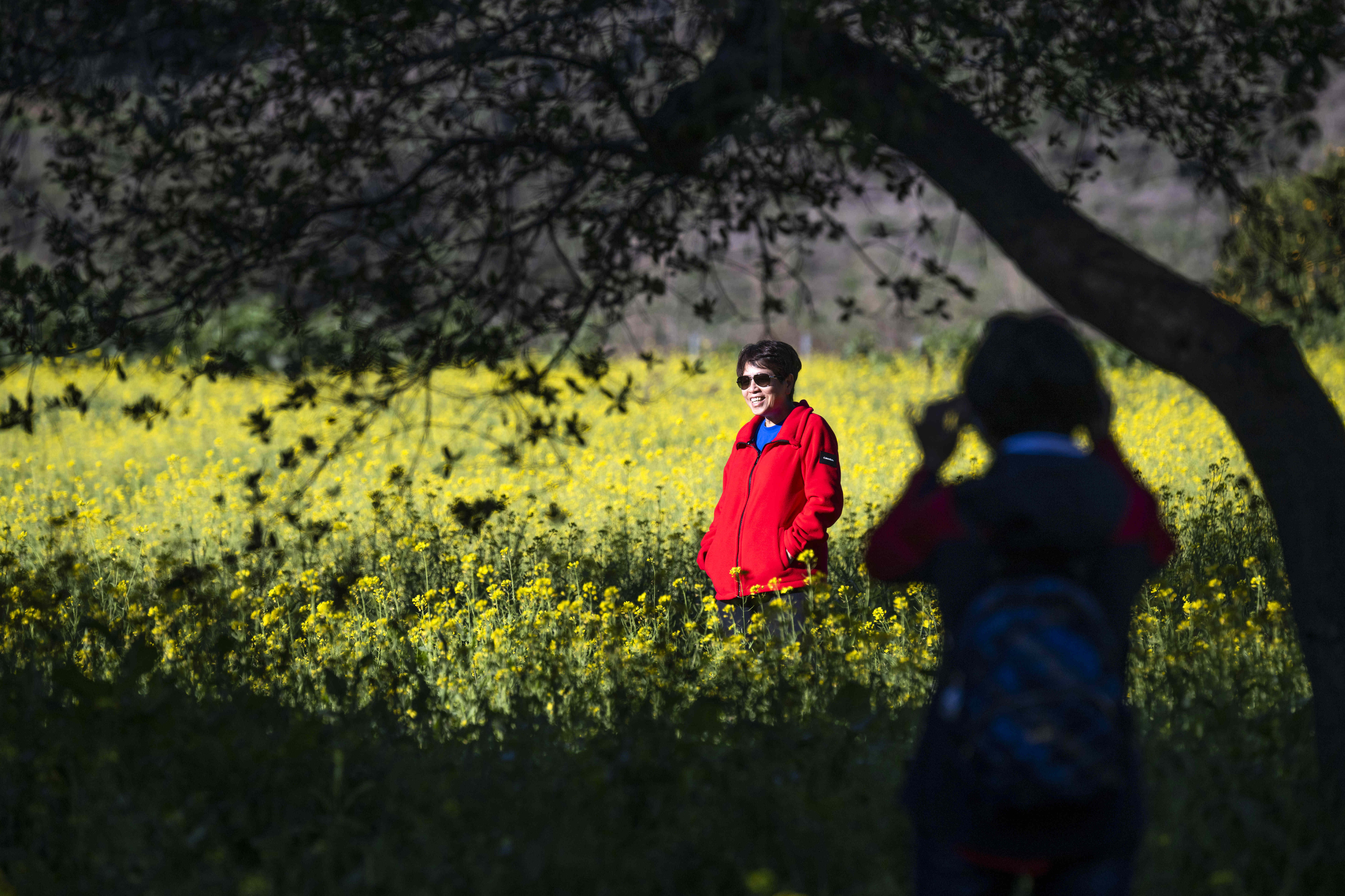 Nancy Duong takes a photo of her sister Loan Duong...