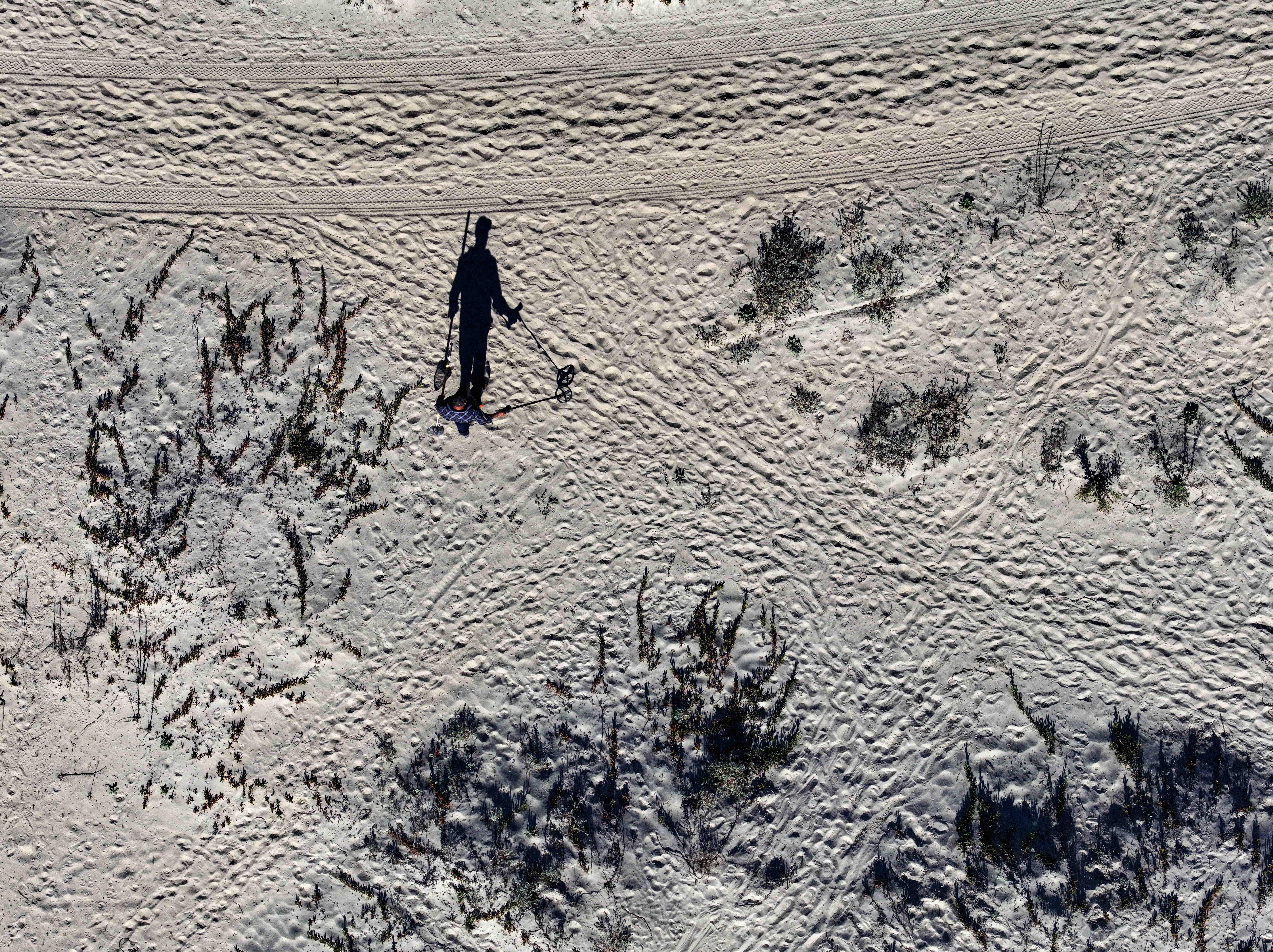 Juan Garcia searches for treasure as he wonders the coastal...
