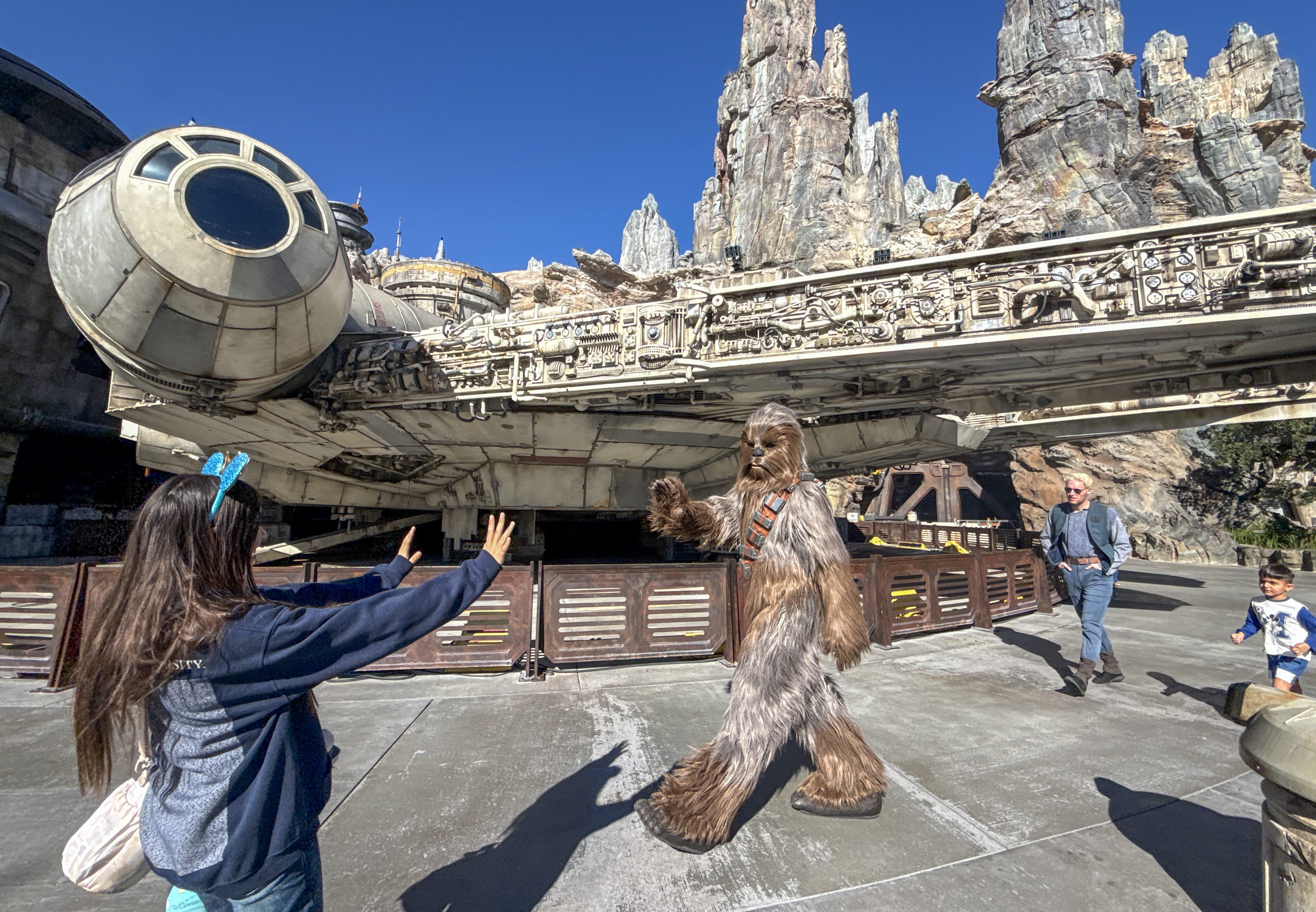 Chewbacca greets visitors at Star Wars: Galaxy’s Edge inside Disneyland...
