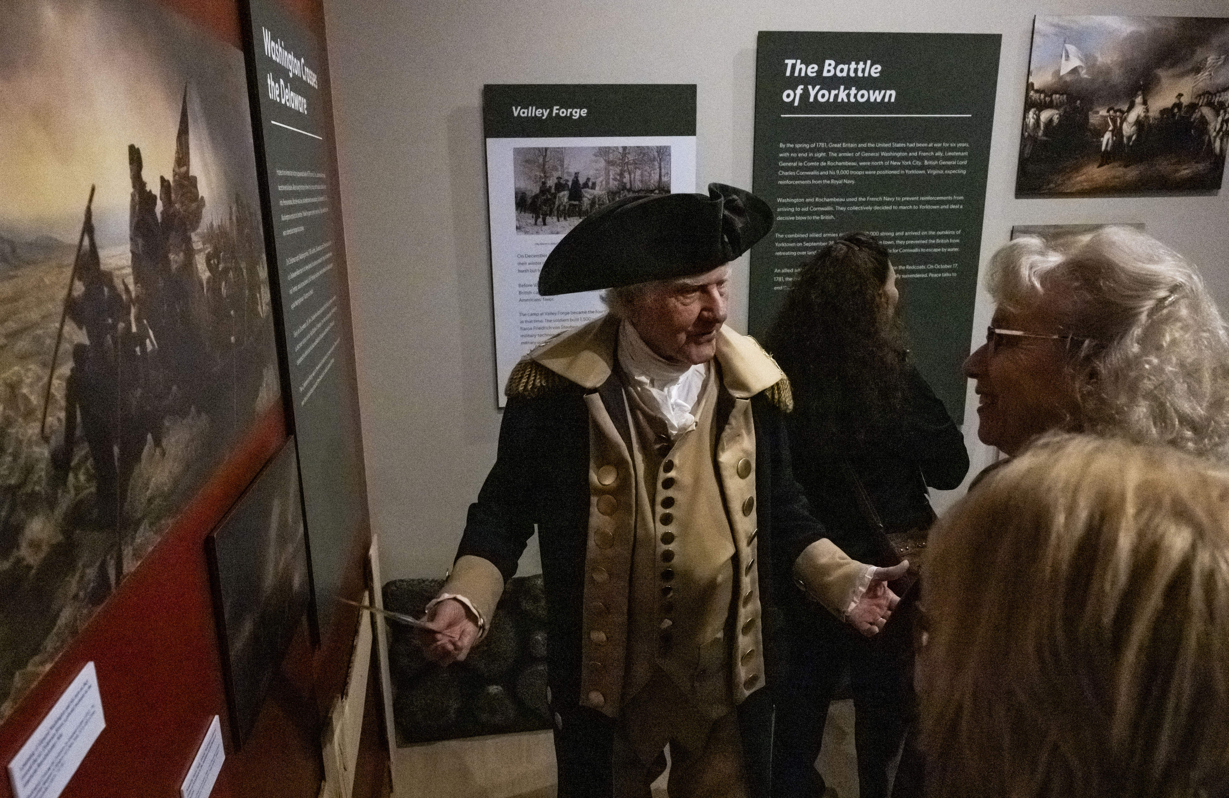 George Washington, played by Gary Beard, talks to visitors about...