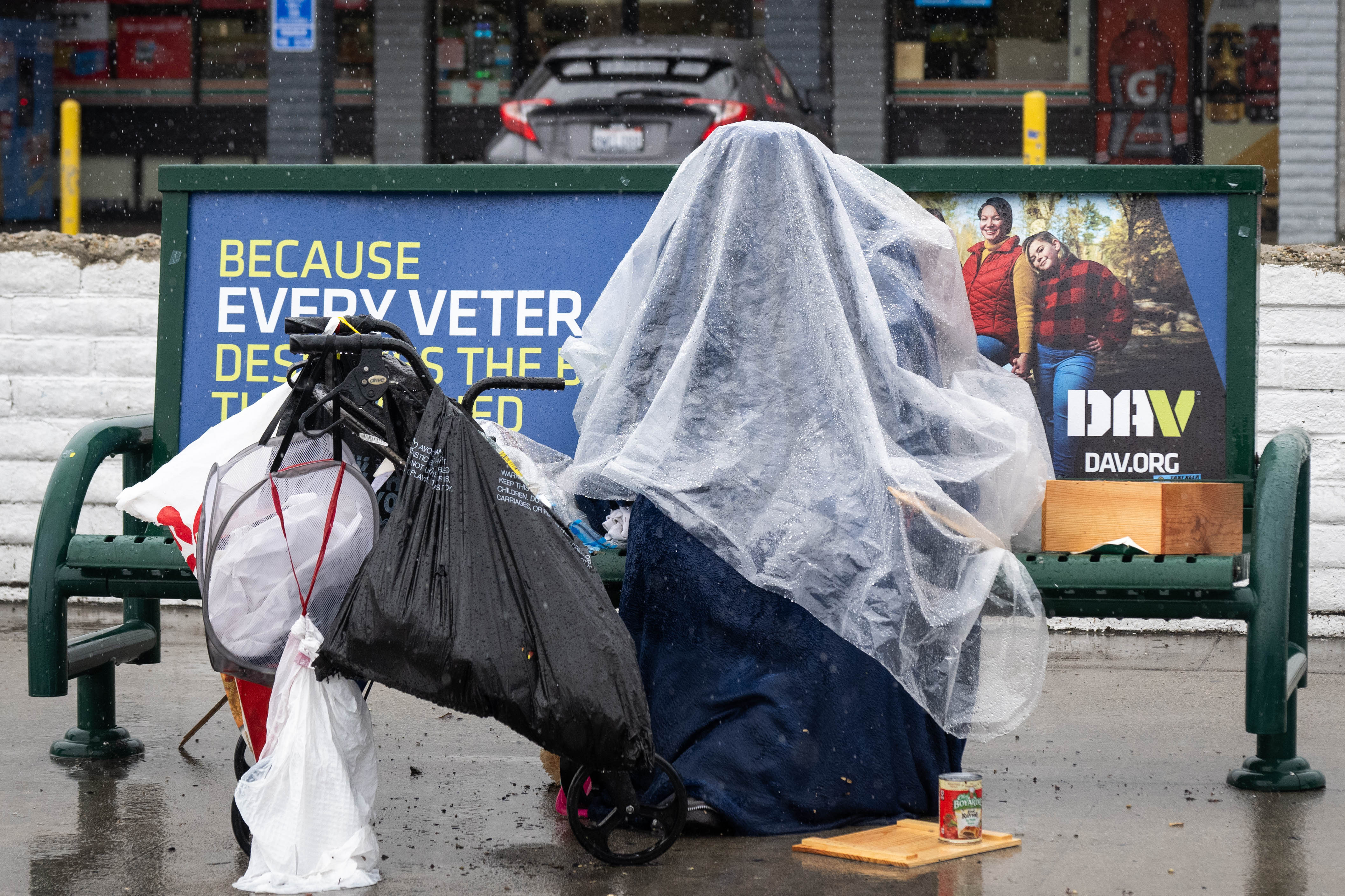 A person shelters from the rain in North Hollywood during...
