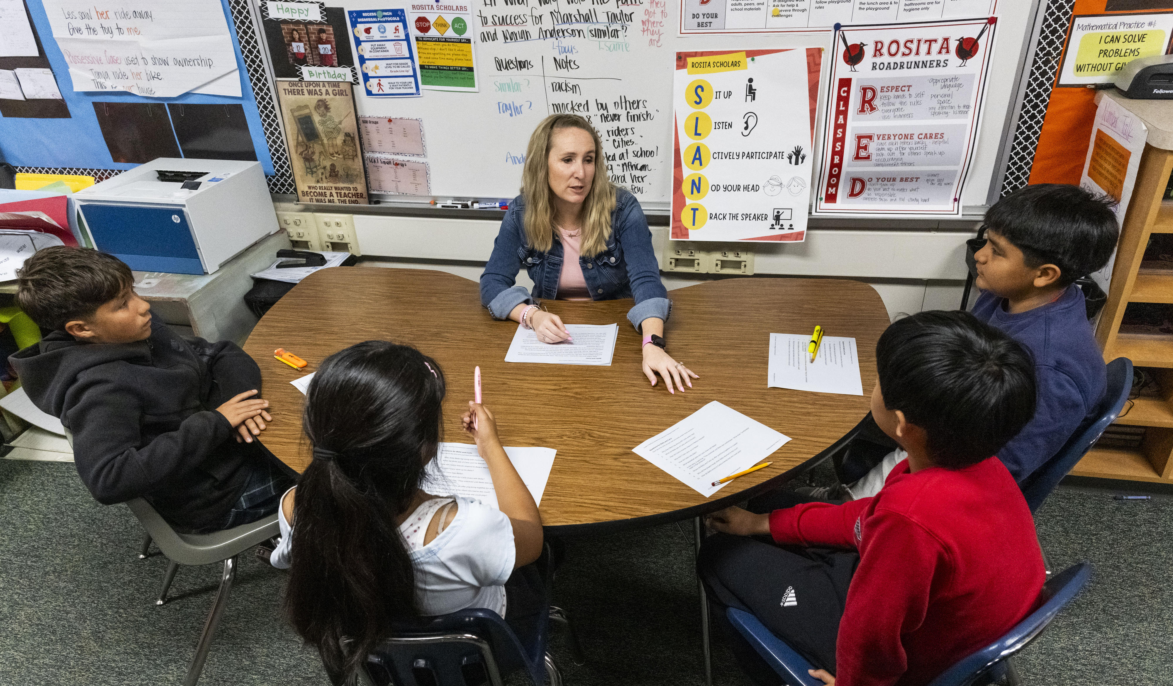 Sixth-grade teacher Lindsay Rachal works with students at Rosita Elementary...