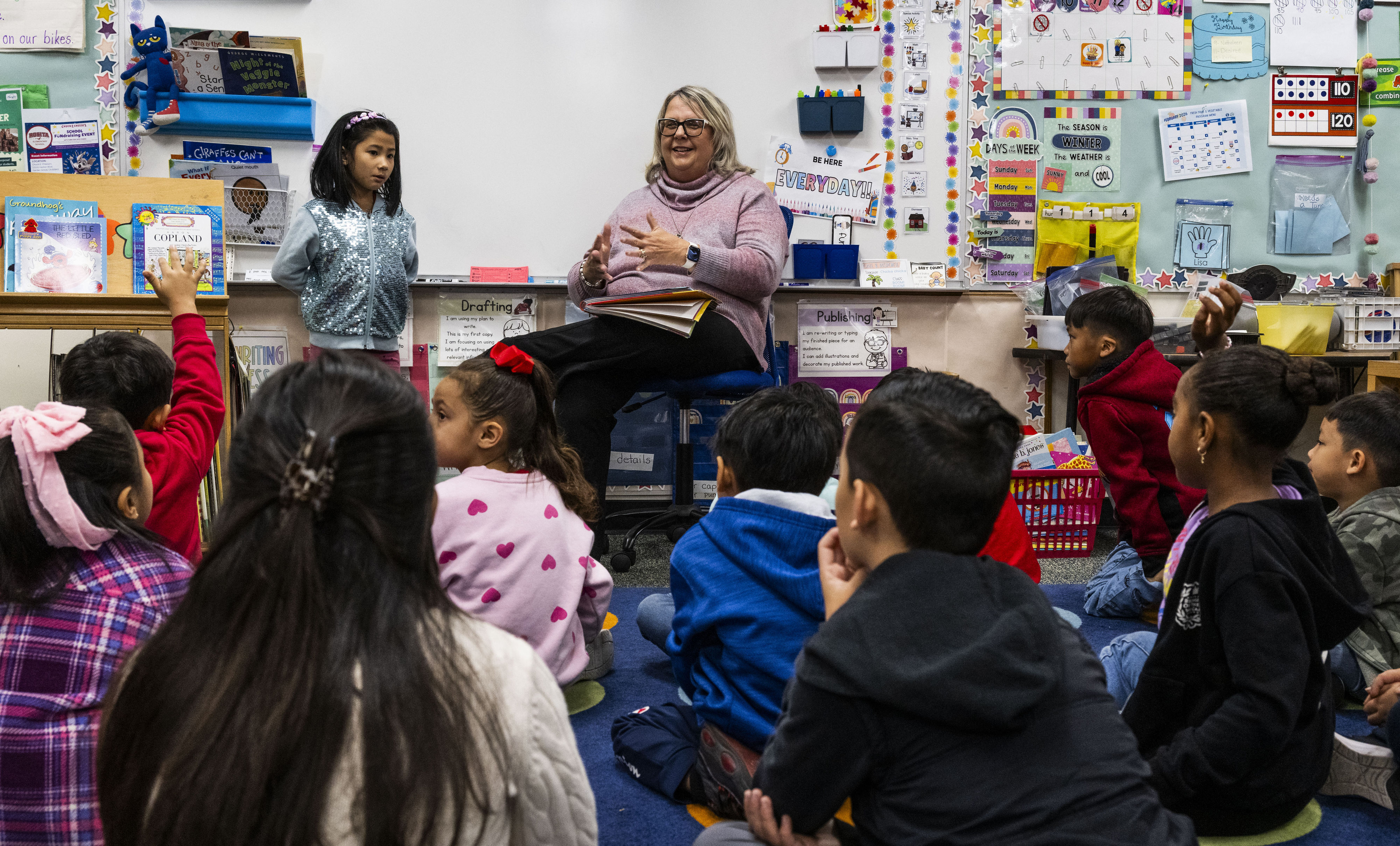 Teacher Kris Corder works with her first-grade students at Rosita...
