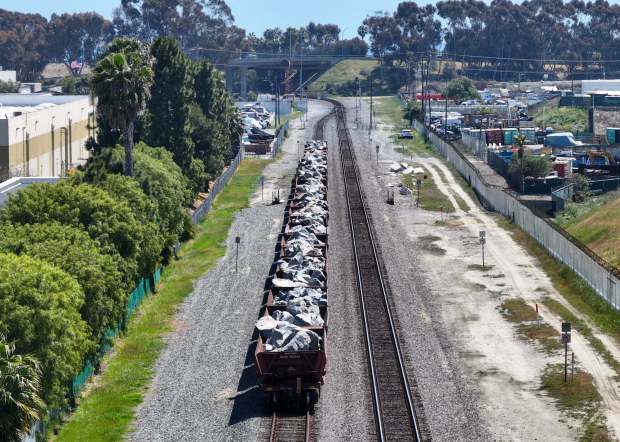 Various size boulders wait in railcars in San Juan Capistrano in 2025. A newly-formed coalition will explore ideas of bringing sand to the beach from Prado Dam, with one possible solution by rail. (Photo by Jeff Gritchen, Orange County Register/SCNG)