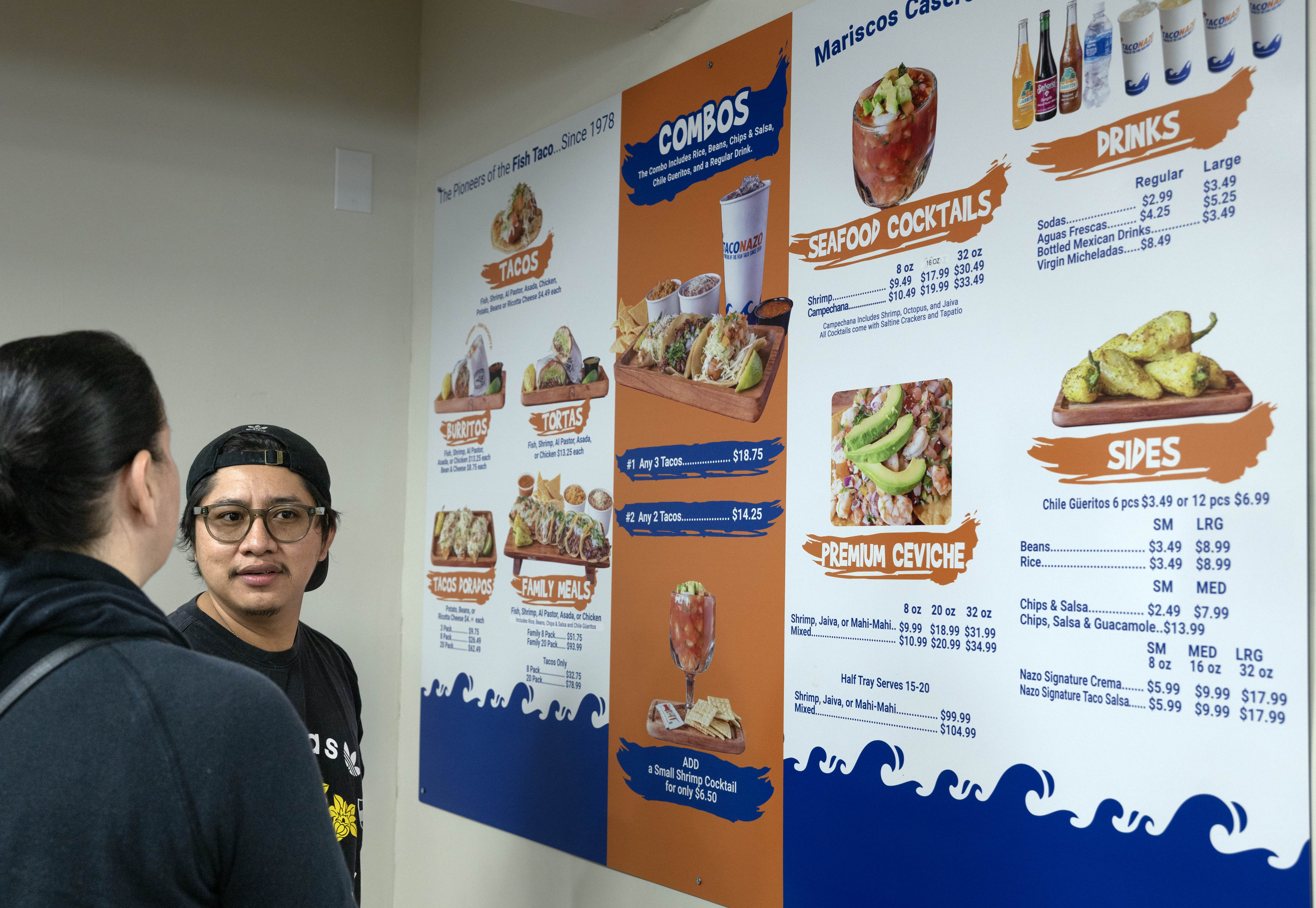 Luis Martinez ponders the menu at newly opened Taco Nazo...