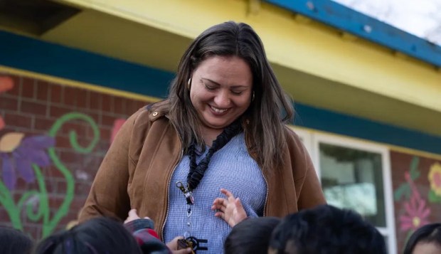 Frisha Moore talks with children at Moore Learning Preschool & Childcare Center in Elk Grove on Feb. 6, 2026. (Miguel Gutierrez Jr., CalMatters)