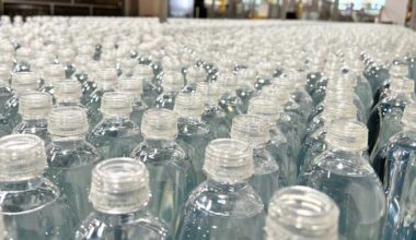 Origin Materials, a West Sacramento-based company that produces more-recyclable plastics like these bottle caps, announced this week that it is cutting operating expenses and reducing its global workforce by about a third as it works to deliver its PET caps to major beverage brands.