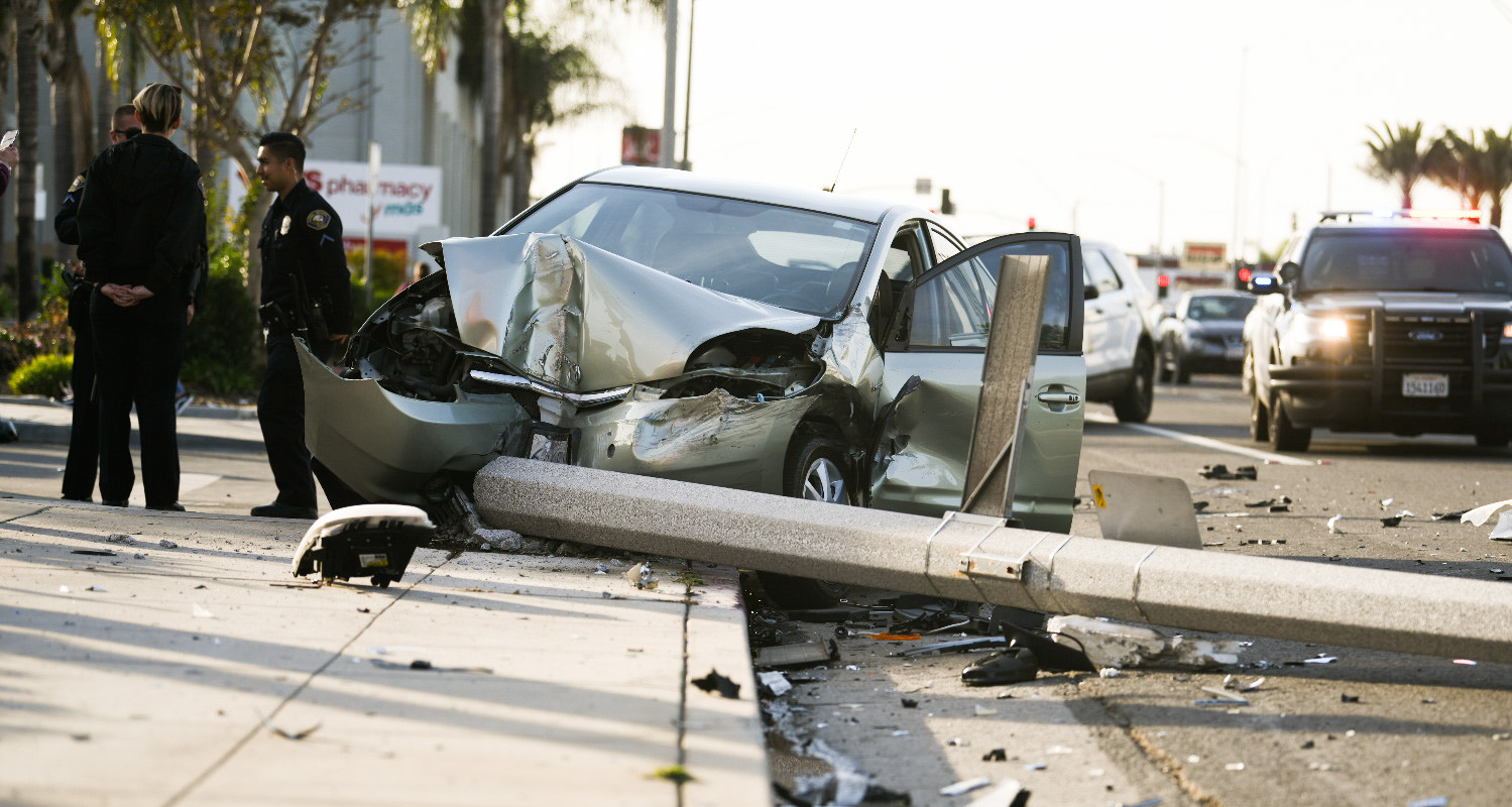 A car crashed into a pole on Pacific Coast Highway near Gundry Avenue on Monday, Dec. 2, 2019. Photo by Thomas R. Cordova.