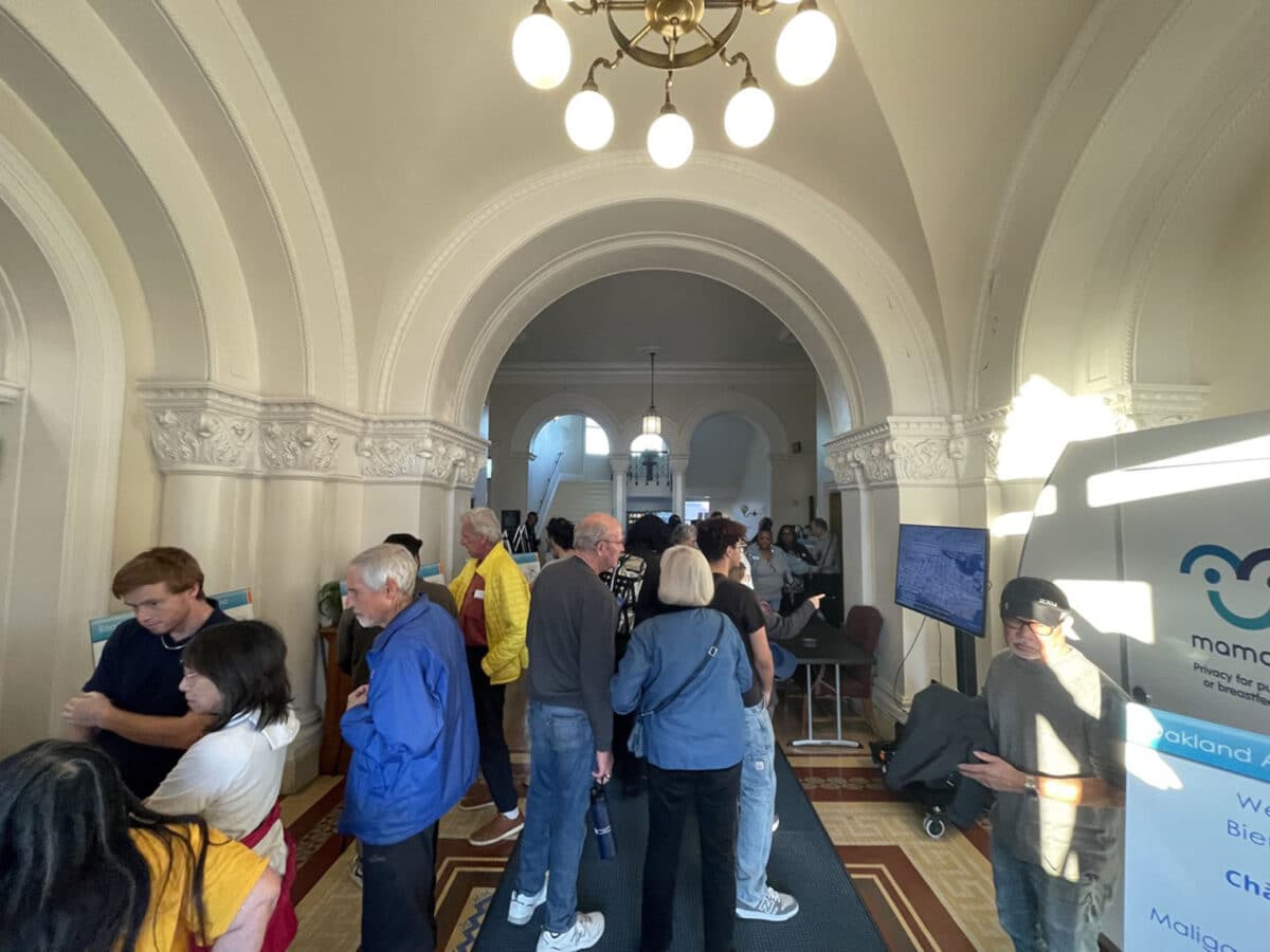 Alameda Post - People gather in the halls of City Hall for the Oakland Alameda Access Project update.