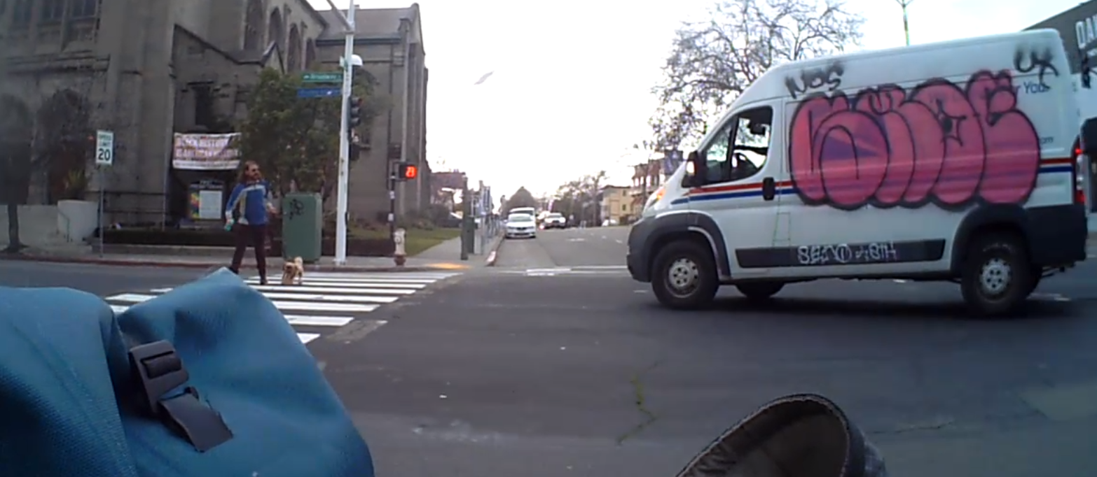 Oakland Postal Worker Yells 'Move' and Nearly Runs Down a Man Walking his Dog