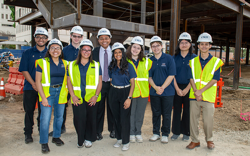 President Rochon and group of engineering and computer science students