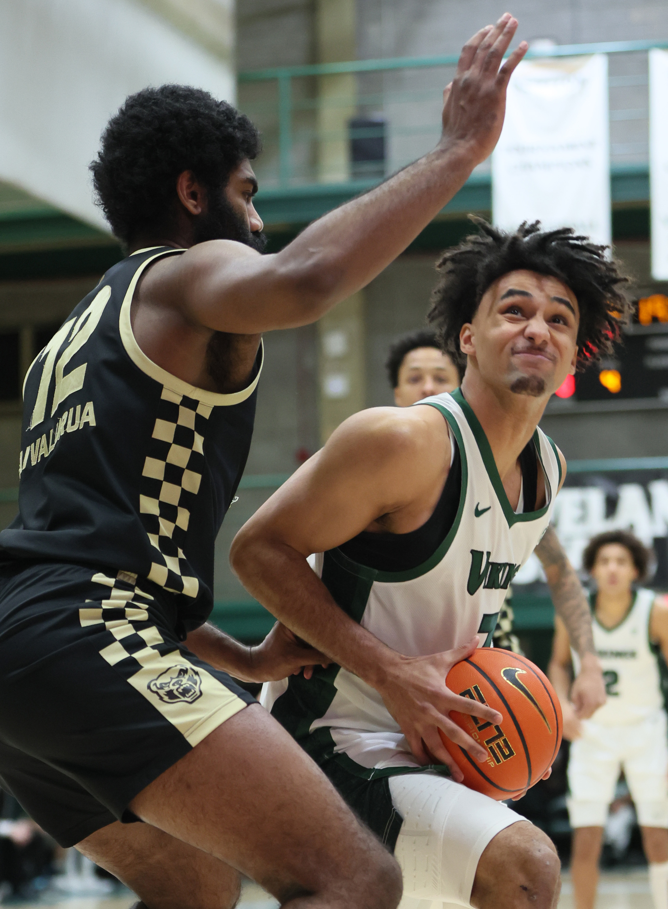 Cleveland State Vikings forward Dayan Nessah drives to the basket guarded by Oakland Golden Grizzlies forward Tuburu Naivalurua in the first half.