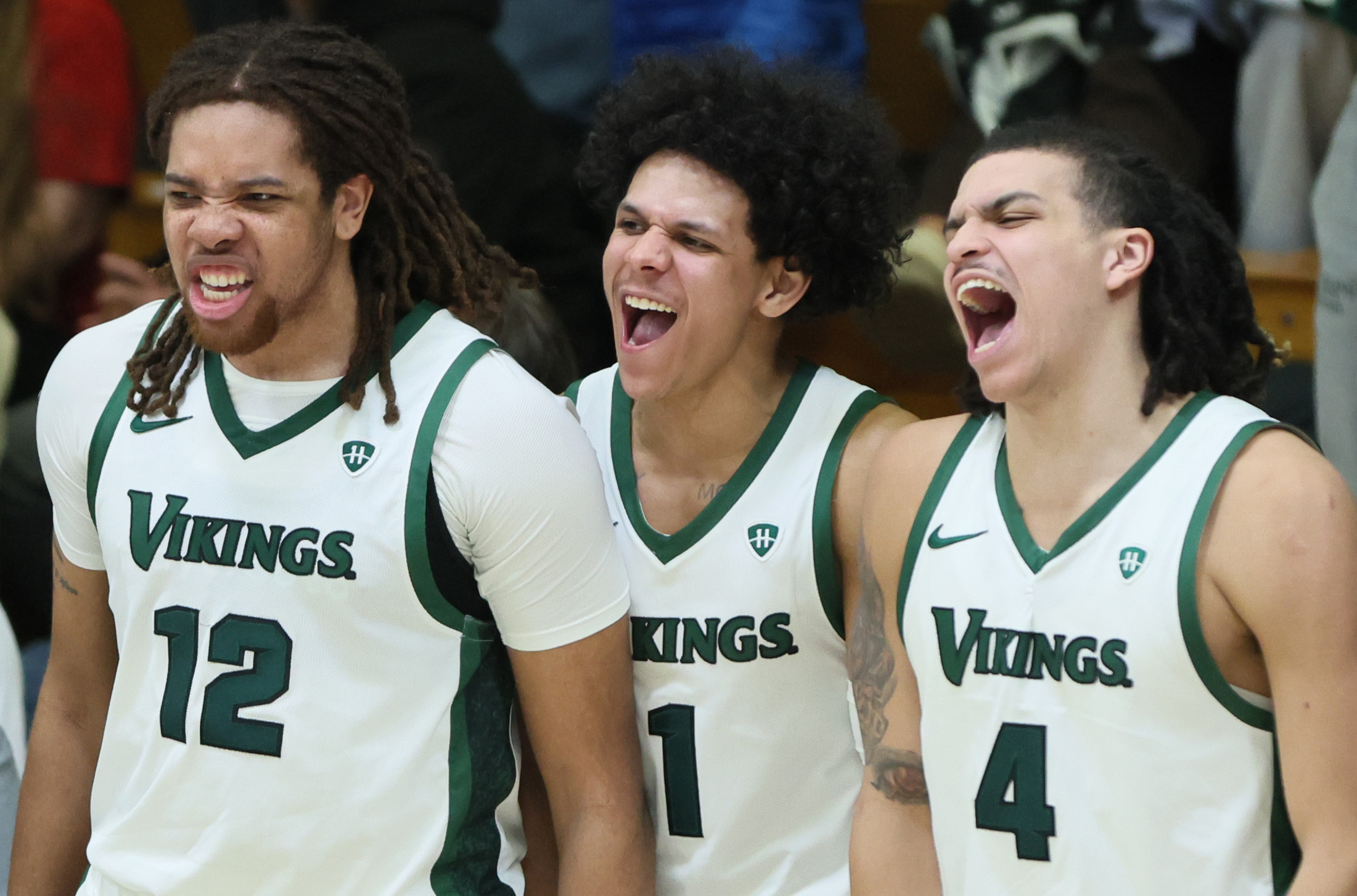 Cleveland State Vikings forward Holden Pierre-Louis (l-r), guard Chevalier Emery and forward Preist Ryan celebrate a score in the second half against the Oakland Golden Grizzlies.  