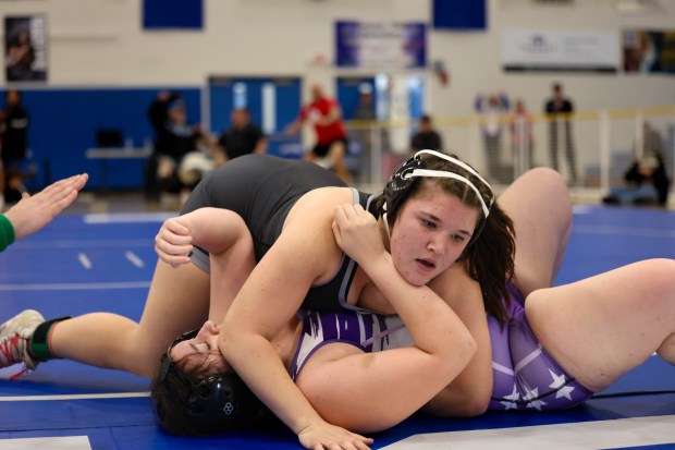 Ramona High School sophomore Robin Moore sealed the championship with a pin in just 1 minute and 5 seconds, pushing the Bulldogs over the threshold to capture the San Diego CIF Division 3 Championship by a narrow 2.5-point margin. With the clutch victory, Moore also earned her spot at the Masters Tournament. (Stephanie Ogilvie)