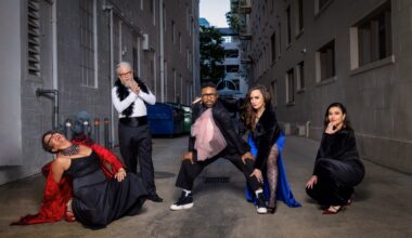 A band stands in a alley