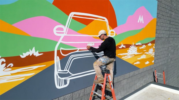 Car Pros Kia Moreno Valley commissioned local artist Patrick Barwinski to paint a mural on its newly expanded service center. The dealership spent $2.25 million on a 7,500 square-foot addition, expanding its service bays to 27 from 13. (Photo courtesy of Car Pros Kia Moreno Valley)