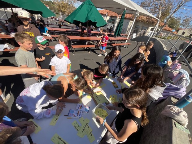 The middle school Leadership Team guides younger students as they write "Kindness Grams" to their peers and staff members. (Courtesy RSF School District)