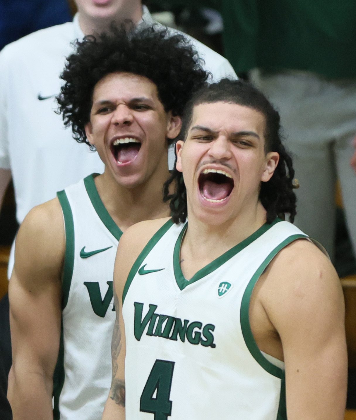 Cleveland State Vikings forward Preist Ryan (4) and Cleveland State Vikings guard Chevalier Emery celebrate the dunk by teammate Vikings forward Dayan Nessah in the second half.  