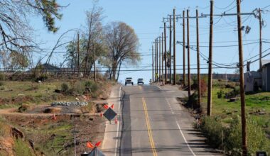 Newly install underground utilities are marked with new asphalt after PG&E crews installed the utilities along Pearson Road on Thursday, Feb. 17, 2022 in Paradise.