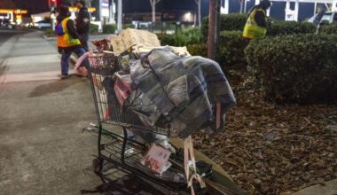 A shopping cart holding the belongings of a homeless person is parked on the sidewalk near Watt Avenue during the Sacramento County Point-in-Time homeless count on Monday, Jan. 26, 2026. The survey is conducted every two years in an attempt to measure the number and demographics of the county's homeless population.