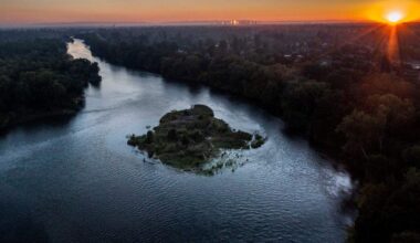 The sun sets on the American River Parkway on Monday, June 27, 2022 near the Watt Ave. bridge. On Thursday, Feb. 26, the Bureau of Reclamation announced initial water supply allocations for urban water agencies.