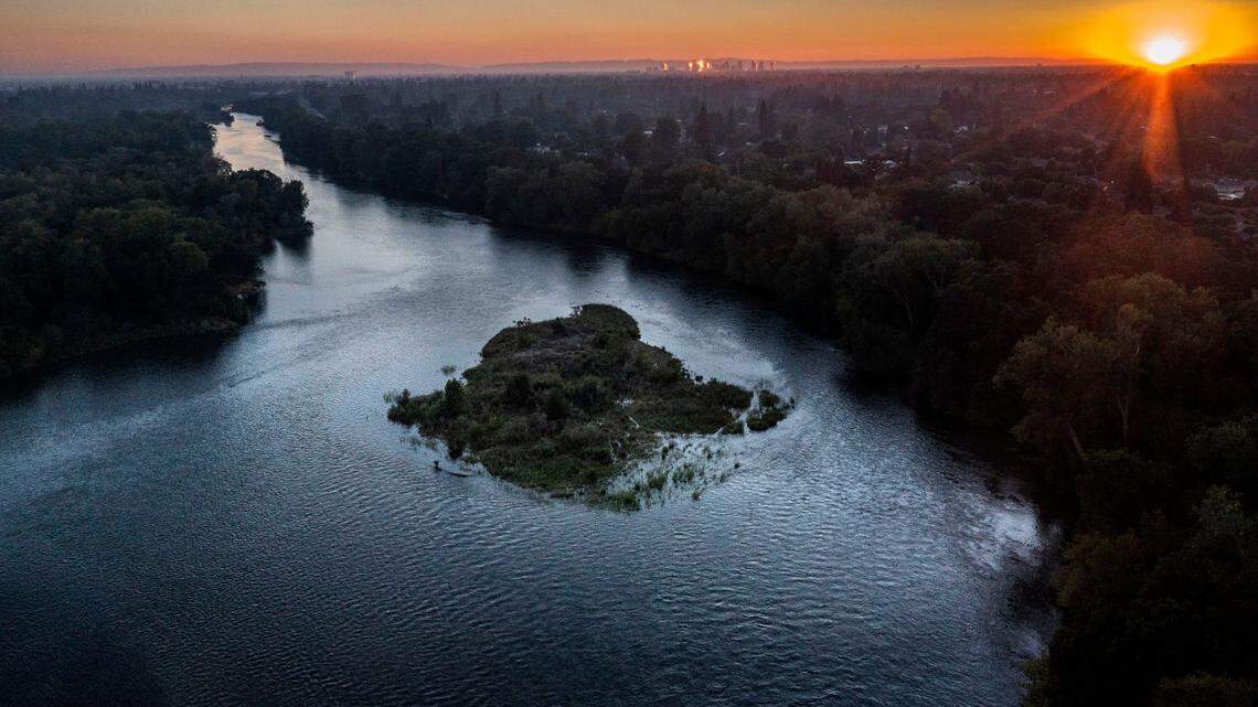 The sun sets on the American River Parkway on Monday, June 27, 2022 near the Watt Ave. bridge. On Thursday, Feb. 26, the Bureau of Reclamation announced initial water supply allocations for urban water agencies.
