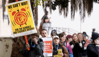 San Francisco teachers on the picket line on strike in February, 2026. The sign reads, "We can't wait"