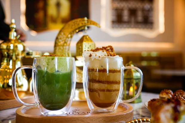A banana cream matcha and Biscoff latte are set at a table with Ramadan decor at the Milyar Cafe in Santa Clara on Feb. 24, 2026. (Shae Hammond/Bay Area News Group)