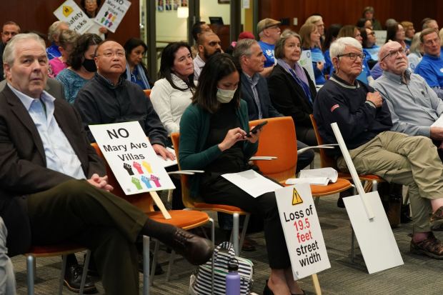Critics of the Mary Avenue Villas, an affordable housing project with dedicated units for those with developmental disabilities, attend the Cupertino City Council meeting on Feb. 3, 2026, citing parking, traffic and legal issues in their opposition. (Irina Trofimchuk)