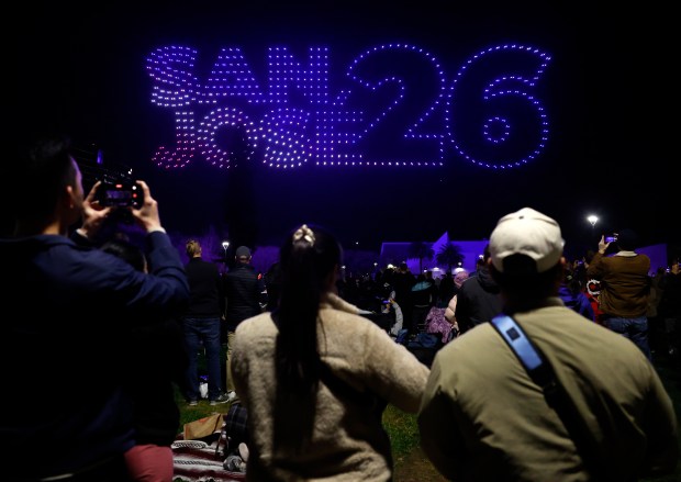 People watch a drone show in Discovery Meadow on Super Bowl Opening Night in downtown San Jose, Calif., on Monday, Feb. 2, 2026. (Nhat V. Meyer/Bay Area News Group)
