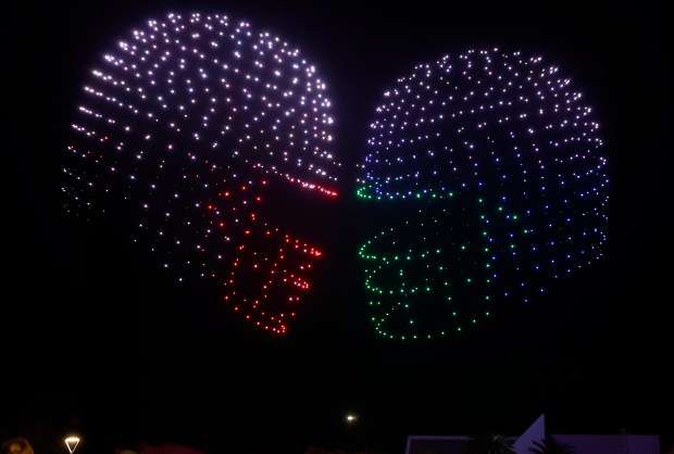 People watch a drone show depicting football helmets in Discovery Meadow on Super Bowl Opening Night in downtown San Jose, Calif., on Monday, Feb. 2, 2026. (Nhat V. Meyer/Bay Area News Group)