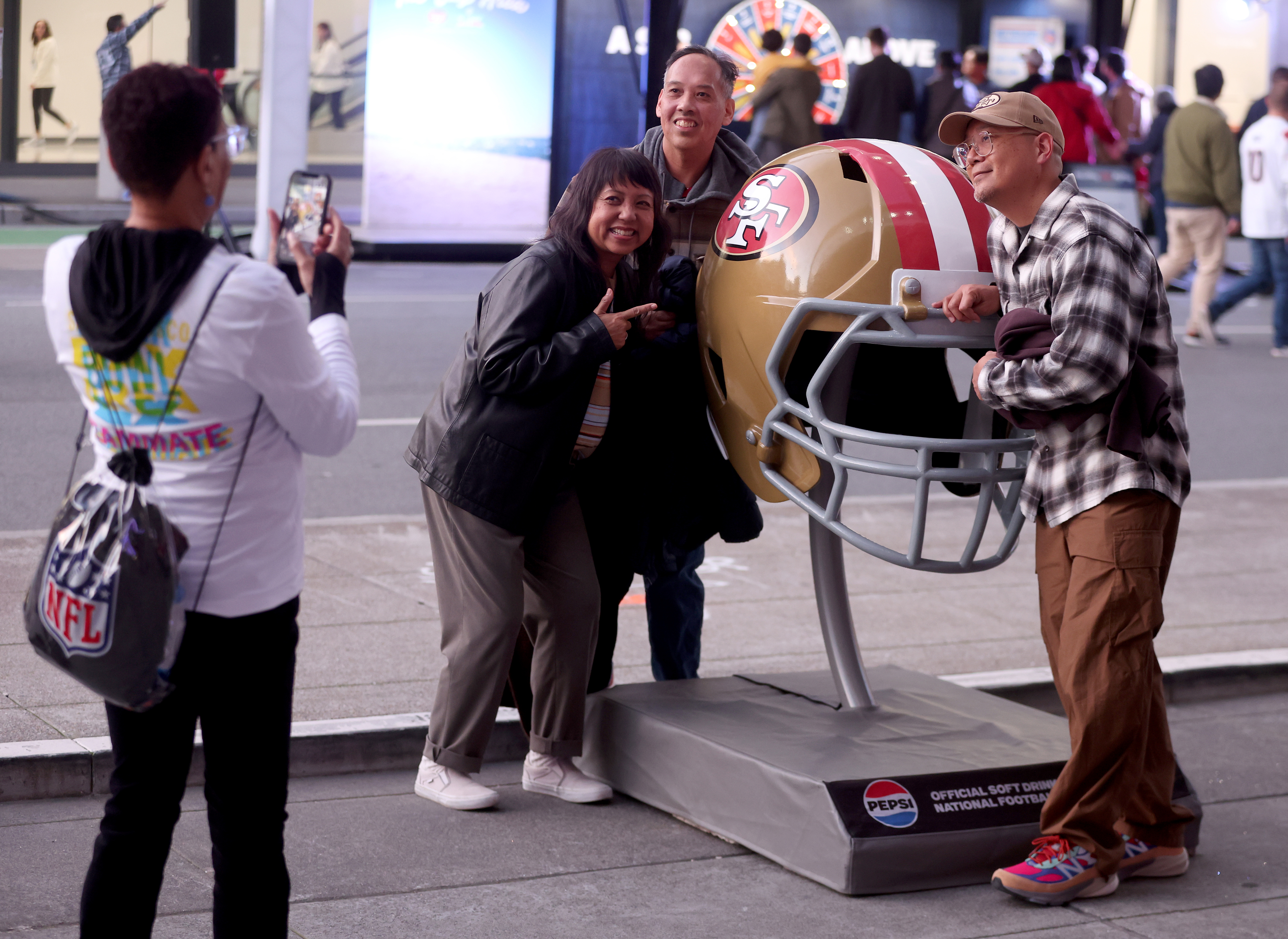 Fans Steve Parpan, Carlos Lucente and his sister Evelyn Lucente,...
