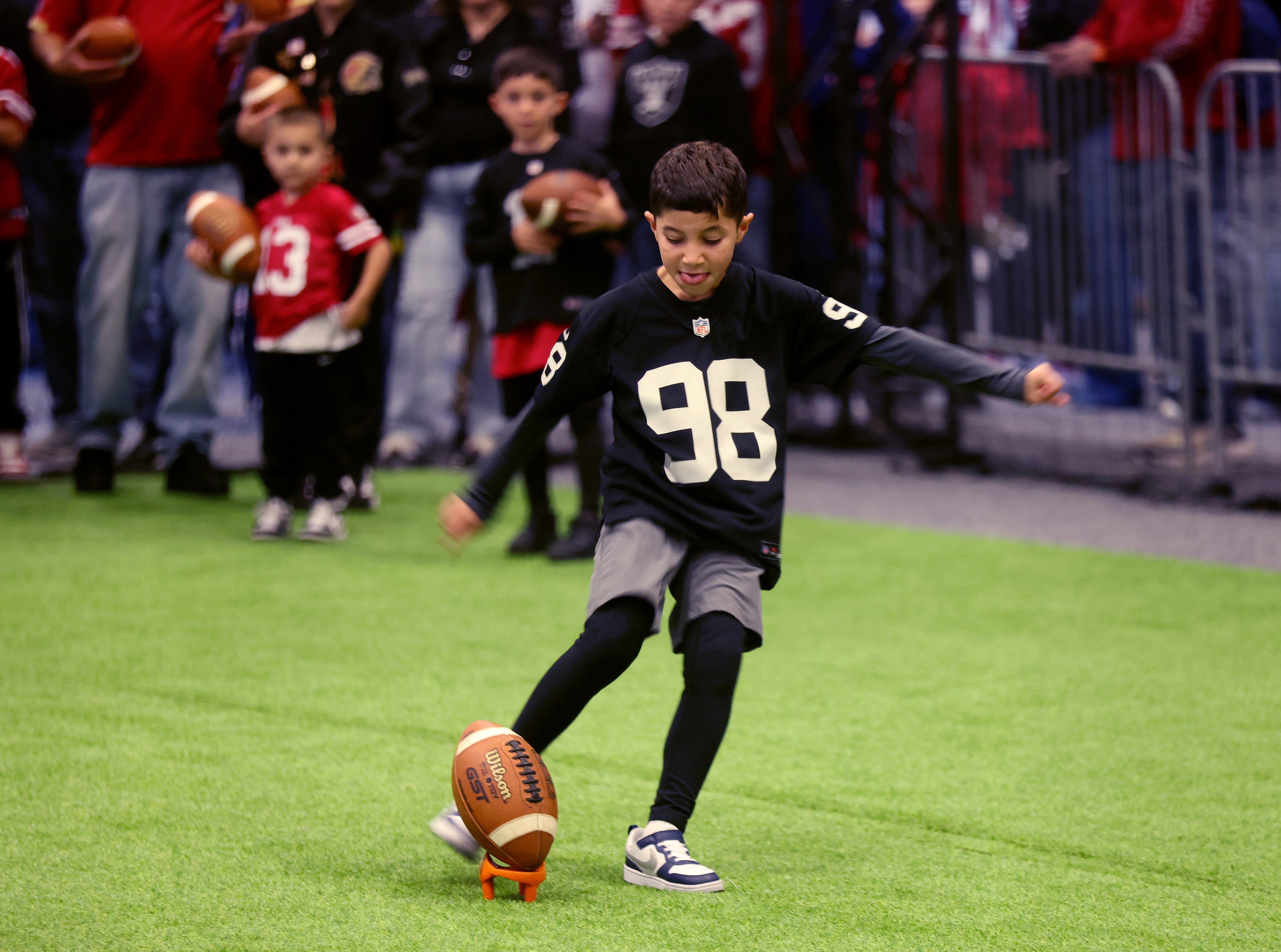 Gil Rangel, 7, of Ripon, kicks a field goal during...