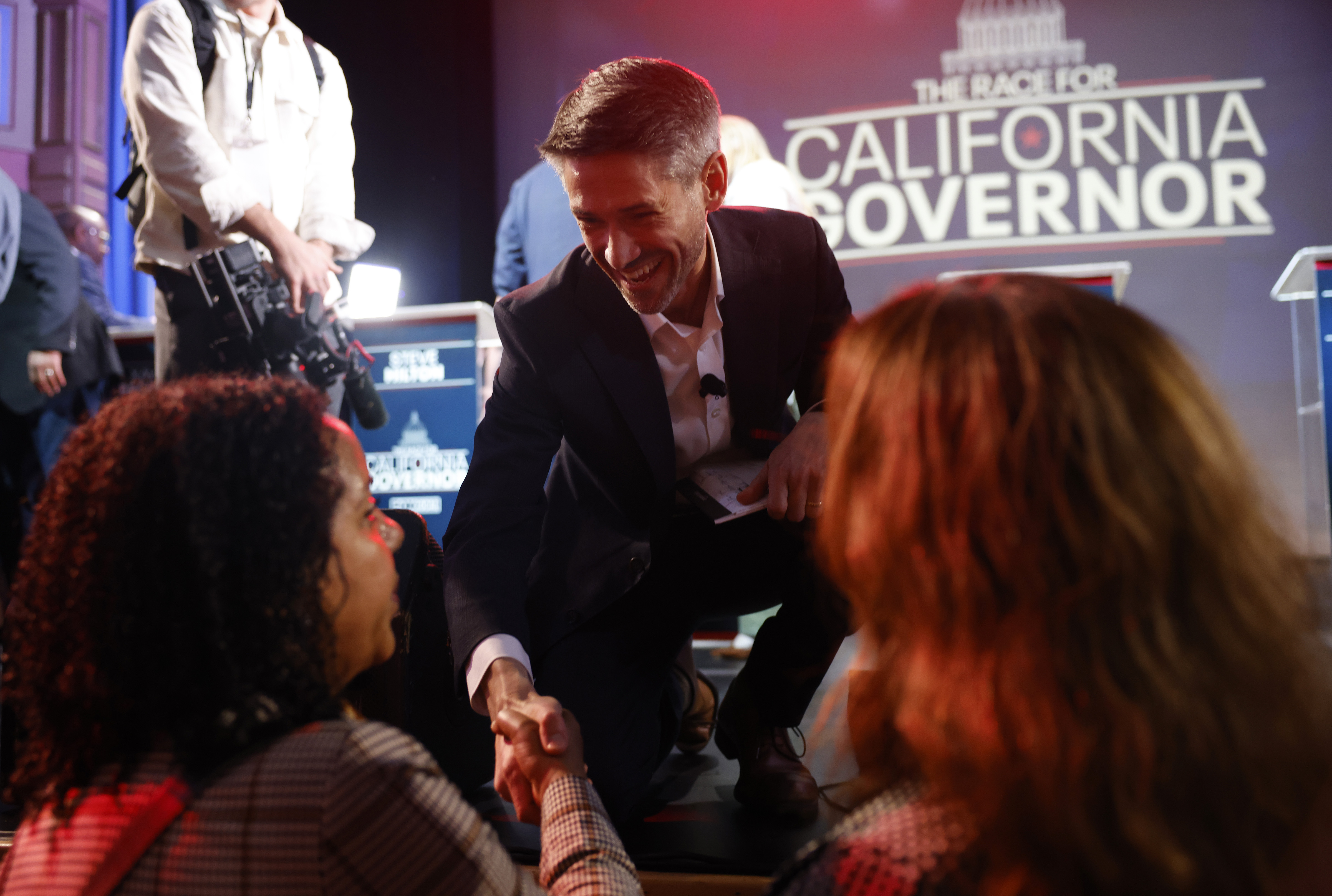 Gubernatorial candidate Matt Mahan, San Jose mayor, shakes hands with...