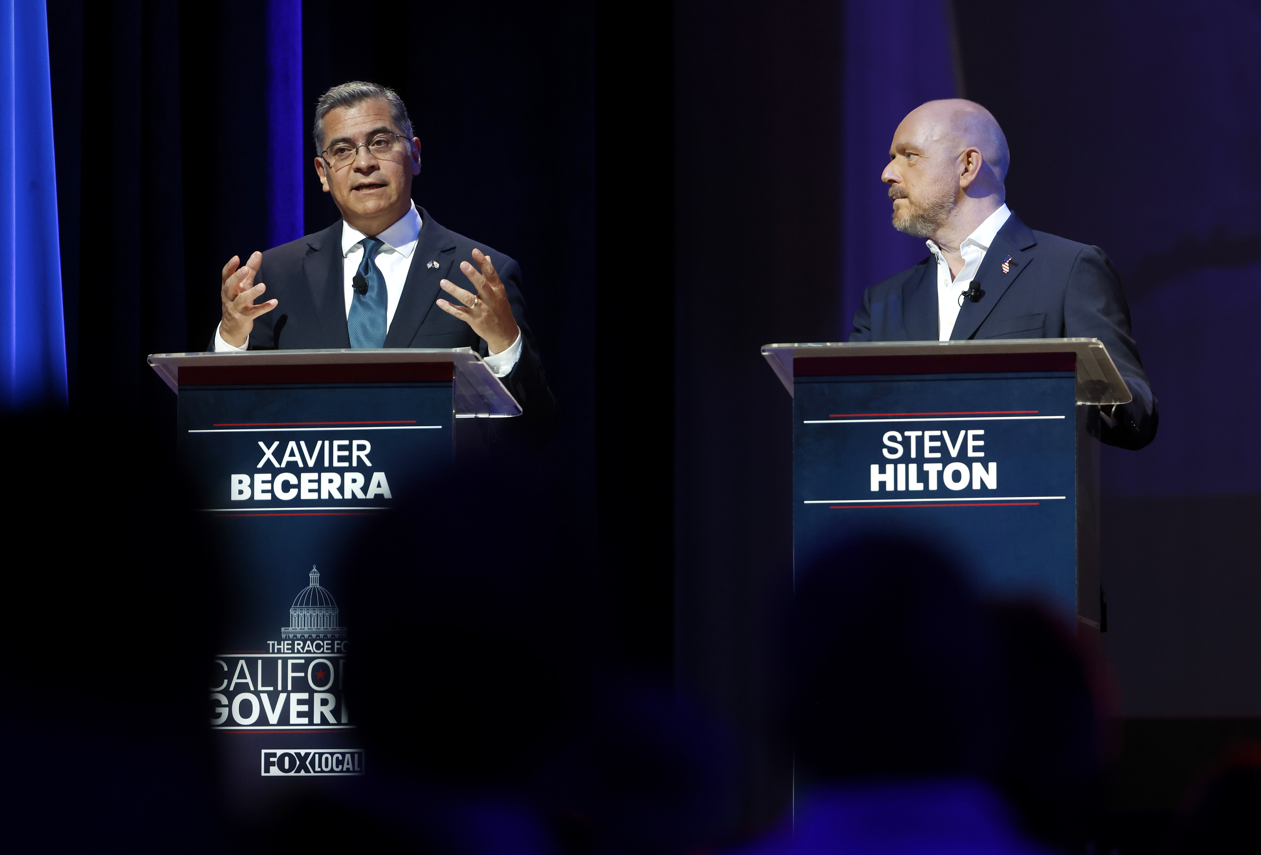 Gubernatorial candidate Xavier Becerra, left, former U.S. Secretary of Health...